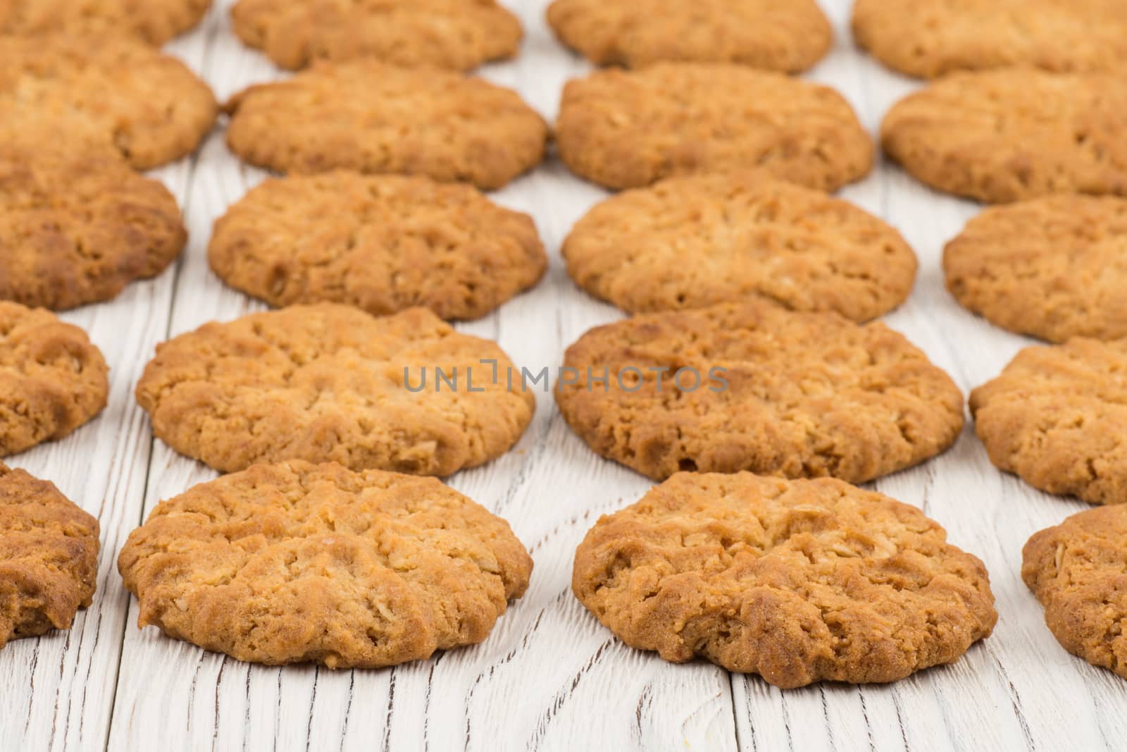 Cookie on old white wooden table. Selective focus.