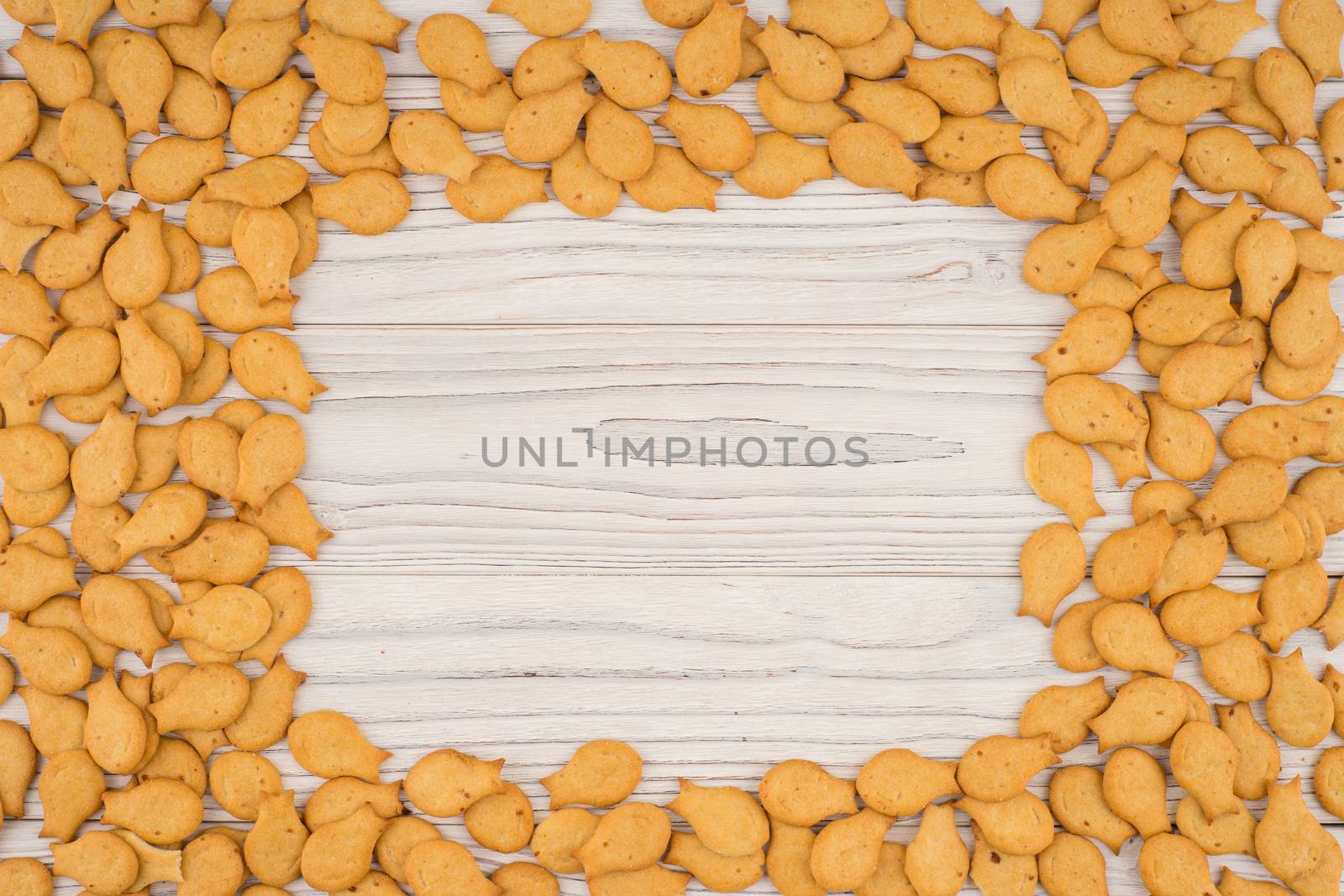 goldfish crackers on an old wooden table. Top view.