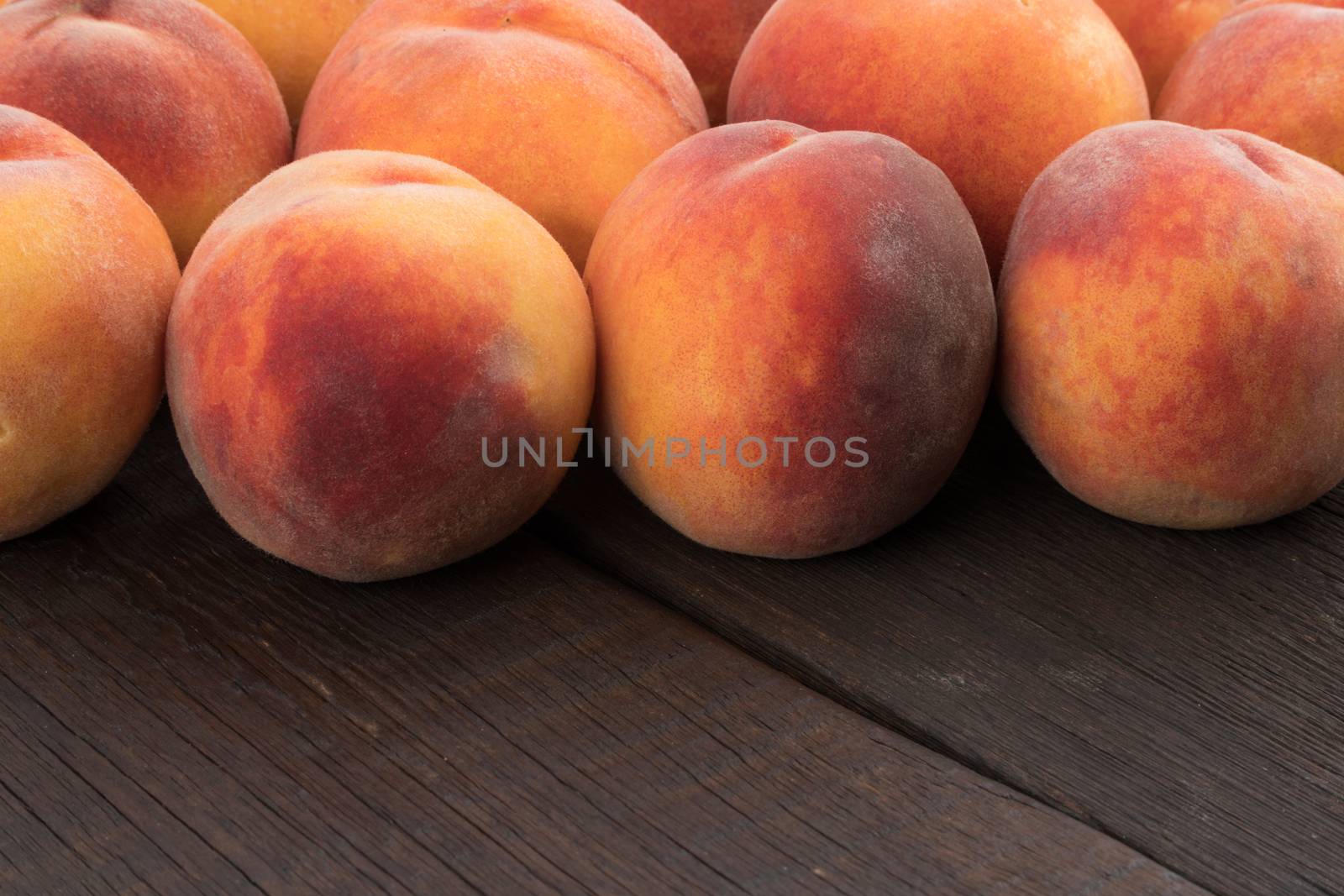 Ripe peaches on old rustic table. Selective focus.
