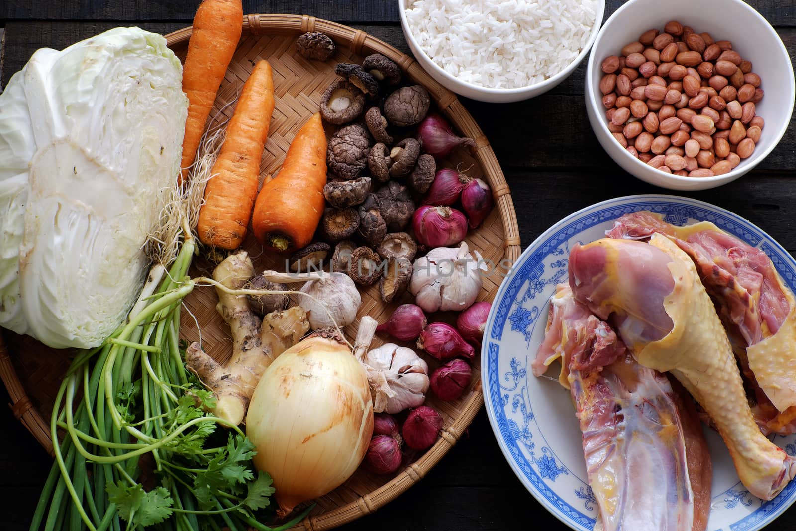 Asian food for sick people, chicken rice gruel with raw material as chicken, rice, carrot, onion, agaric, cabbage. Bowl of chicken porridge with fixed vegetable, also call chao ga