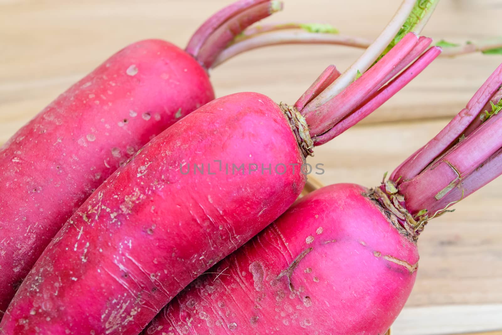 Red radish on wooden table