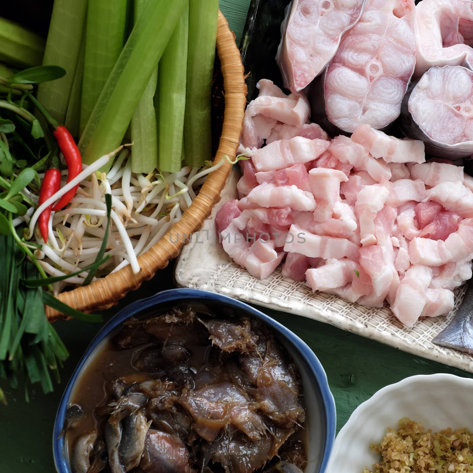 Vietnamese food, mam kho, a featured meal of Mekong Delta, Vietnam. Raw material to cook are basa fish, shrimp, bacon, citronella, garlic, chilli , eat this dish with cooked rice and vegetable