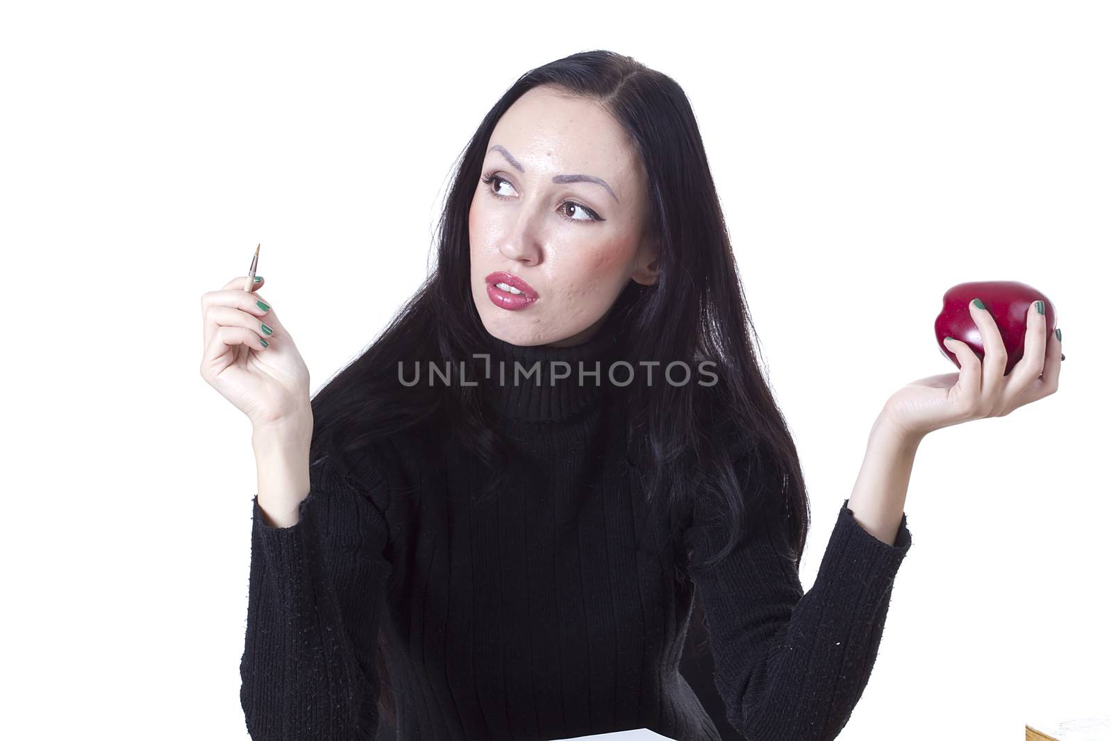 Pretty woman with an apple in his hand on a white background