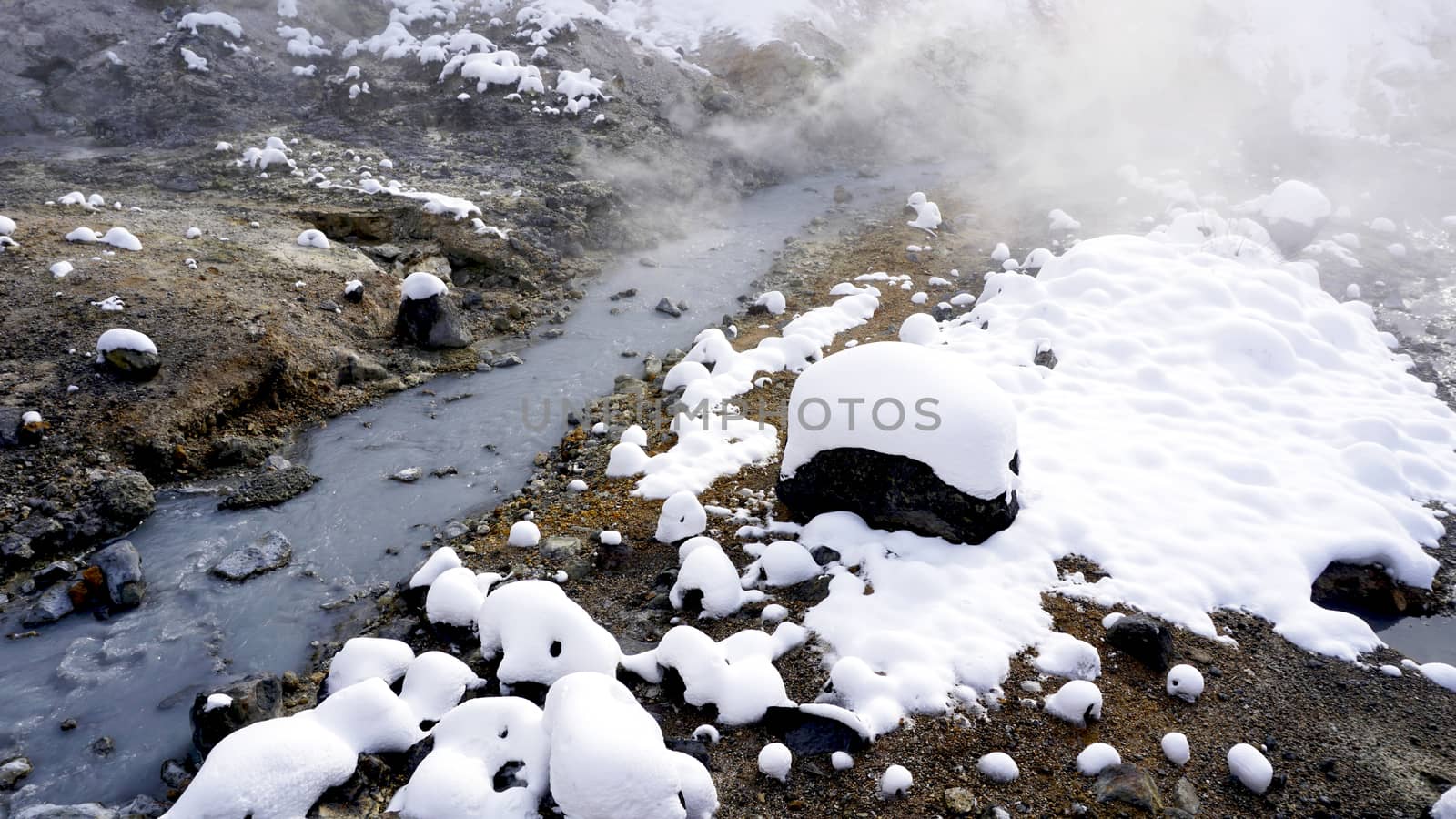 Closeup stone and stream in the mist Noboribetsu onsen by polarbearstudio