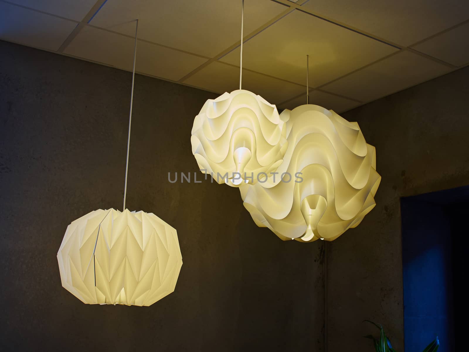 Modern design lamp made out of white parts creating special light effect