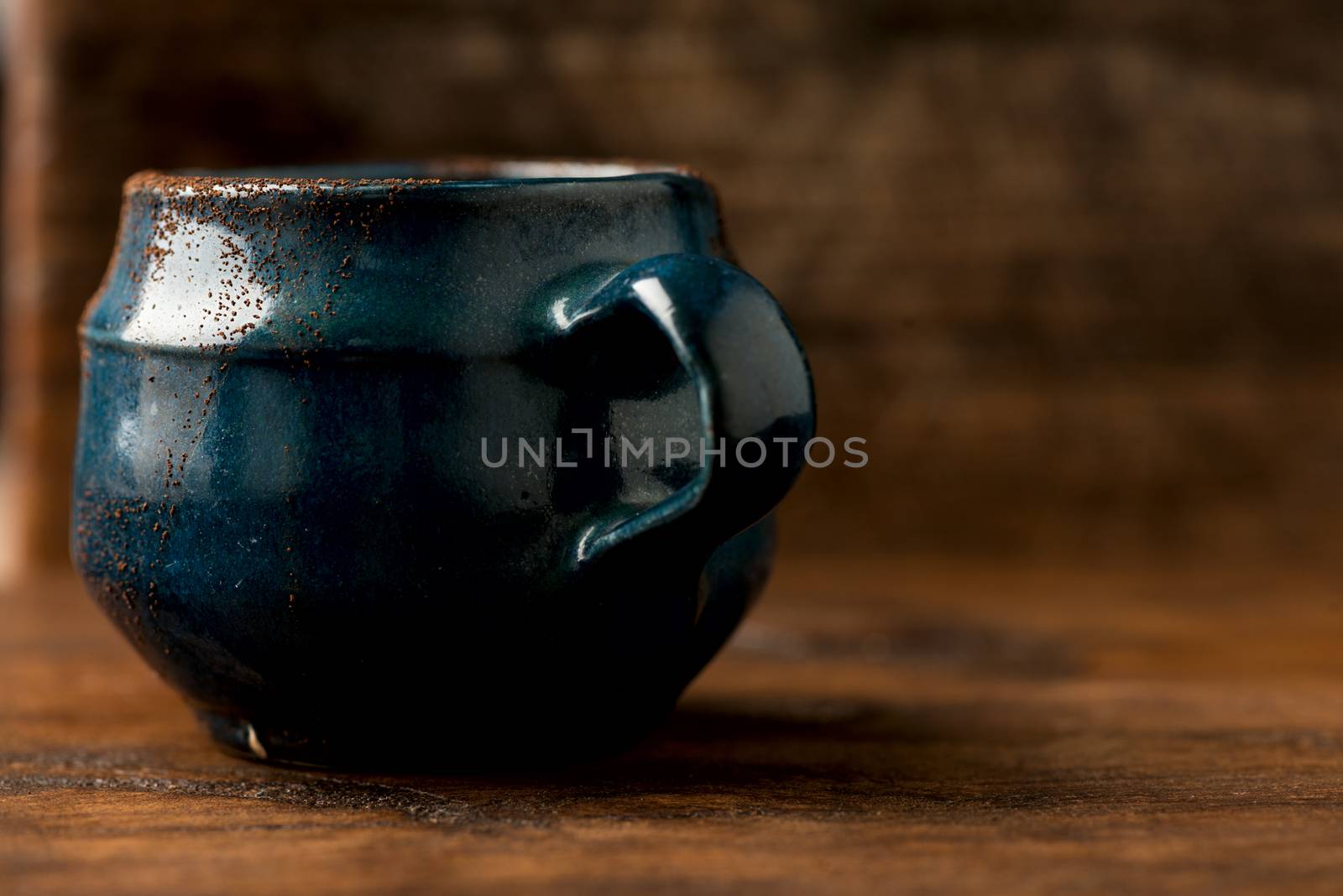 Coffee in grunge blue clay cup by Nanisimova
