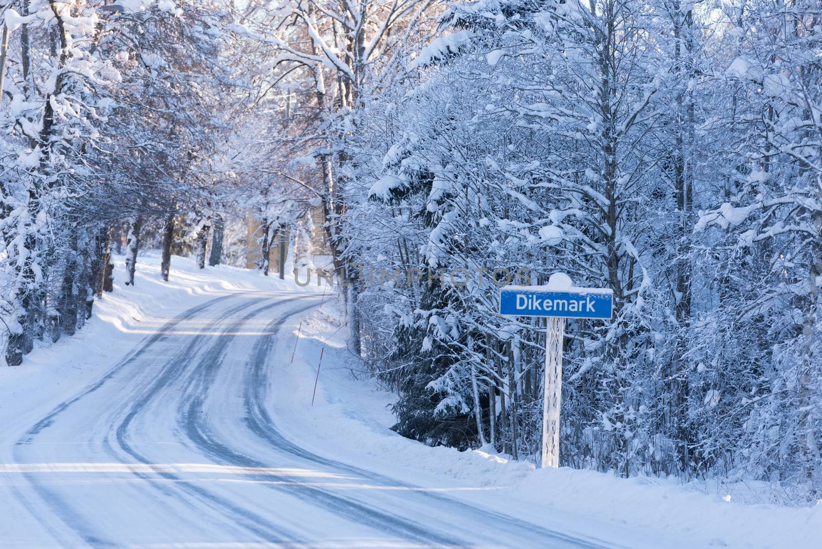 Dikemark road sign on winter road Norway by Nanisimova