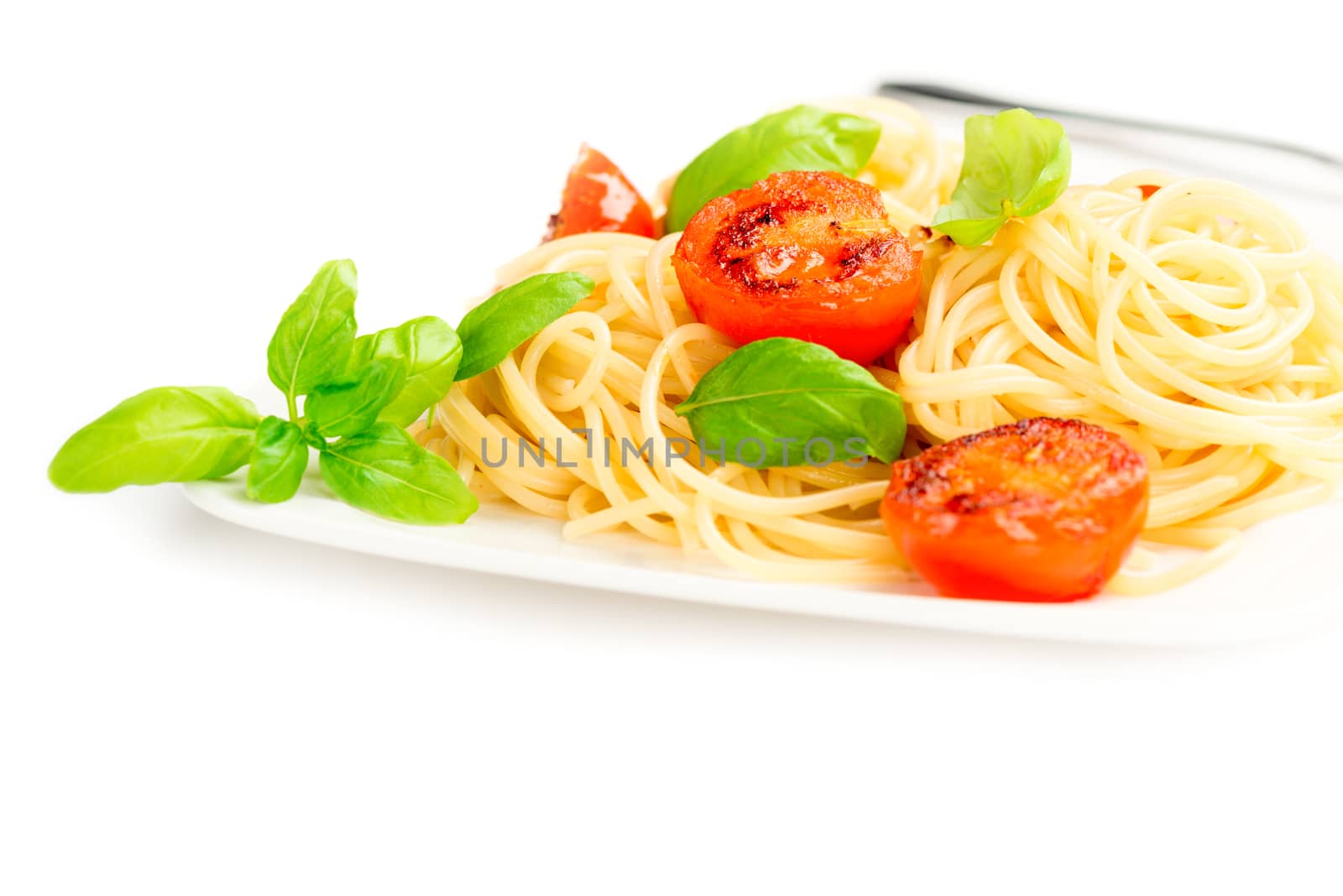 Traditional italian macaroni pasta with grilled tomato and oregano