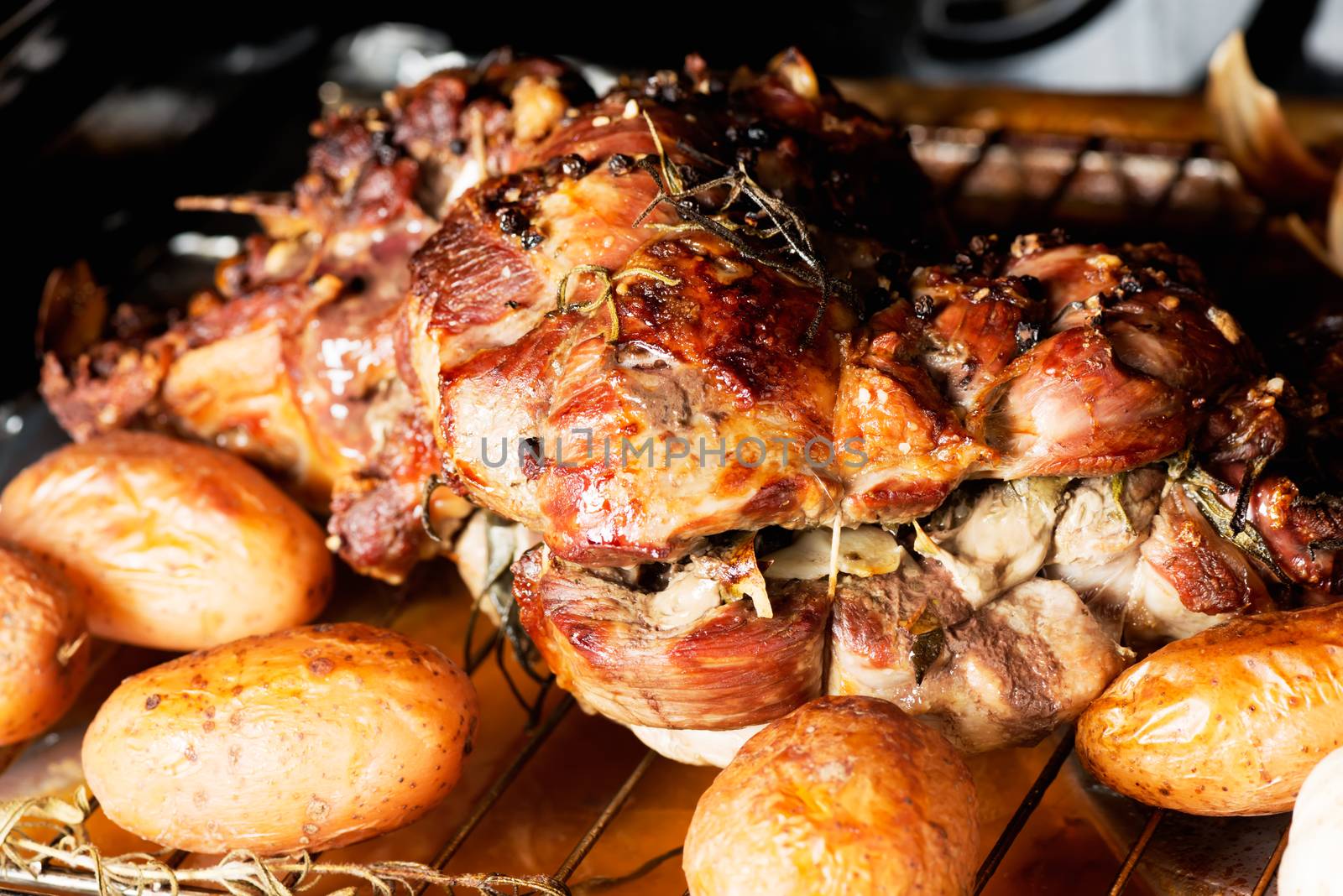 Homemade dish lamb cooking in oven with potatoes