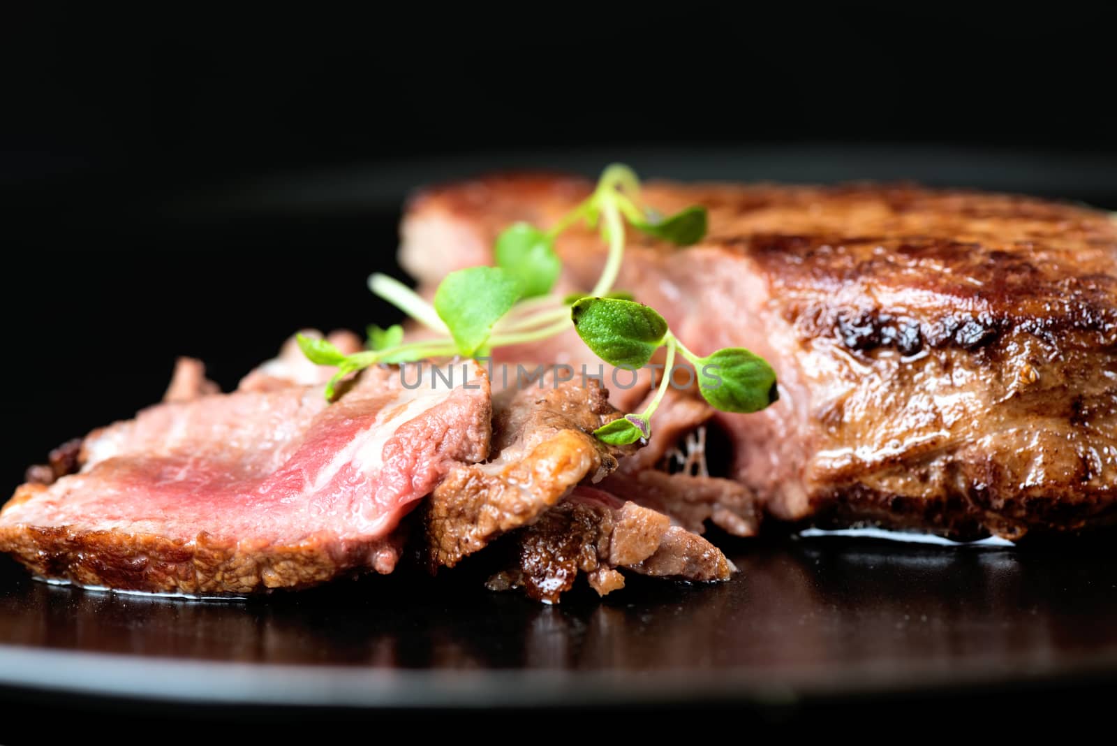 Delicious beef steak on a plate, close-up