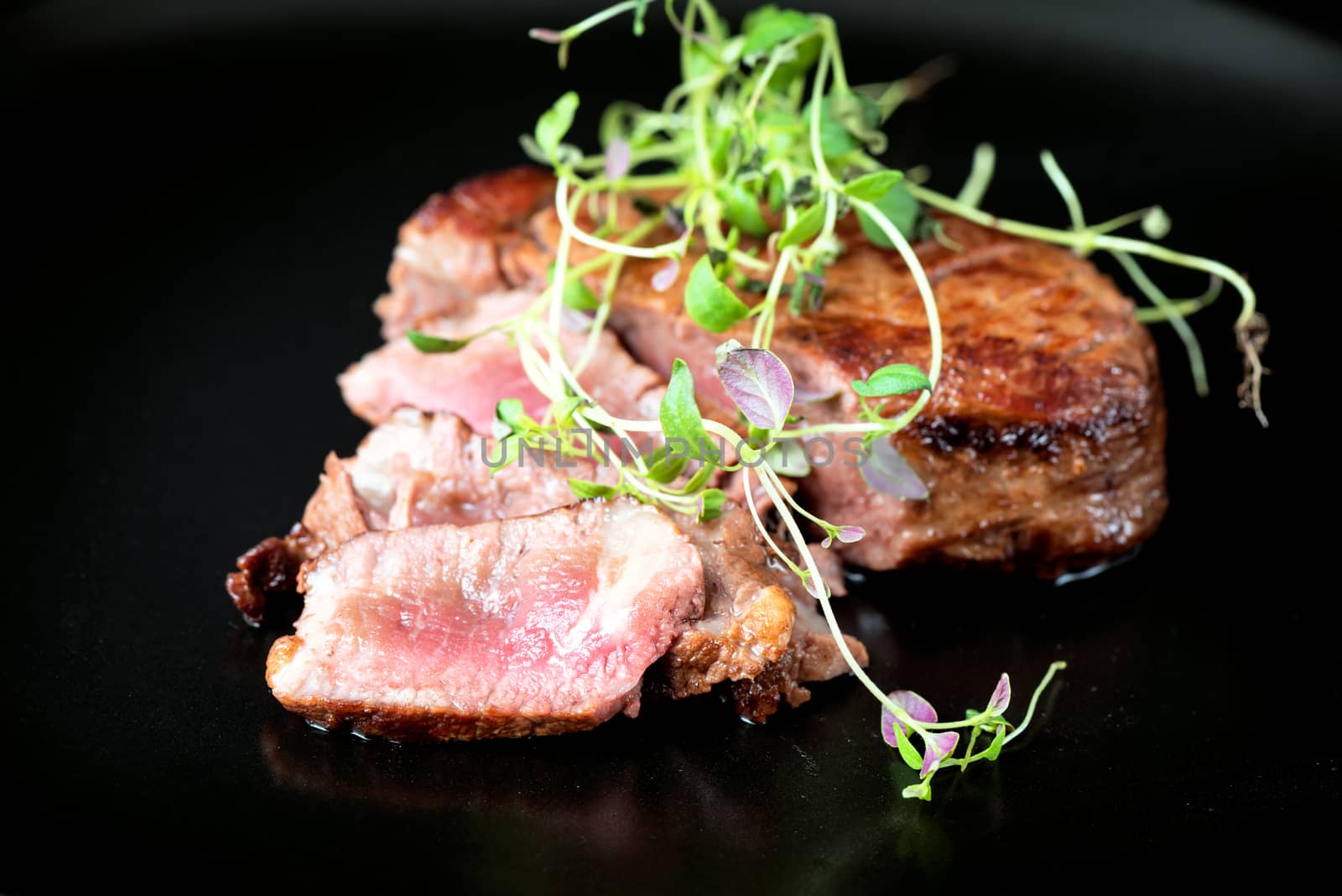 Delicious beef steak on a plate, close-up