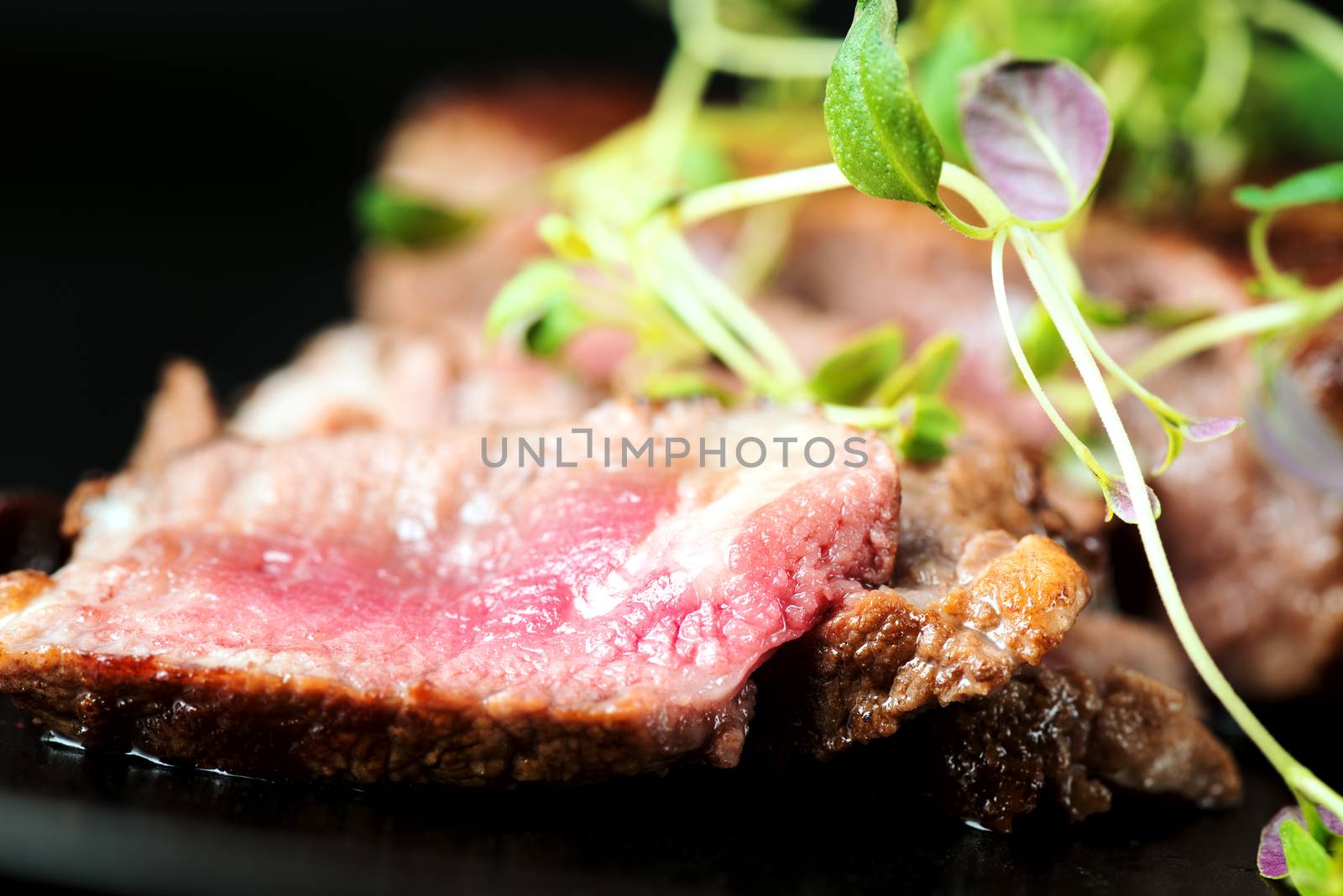 Delicious beef steak on a plate, close-up