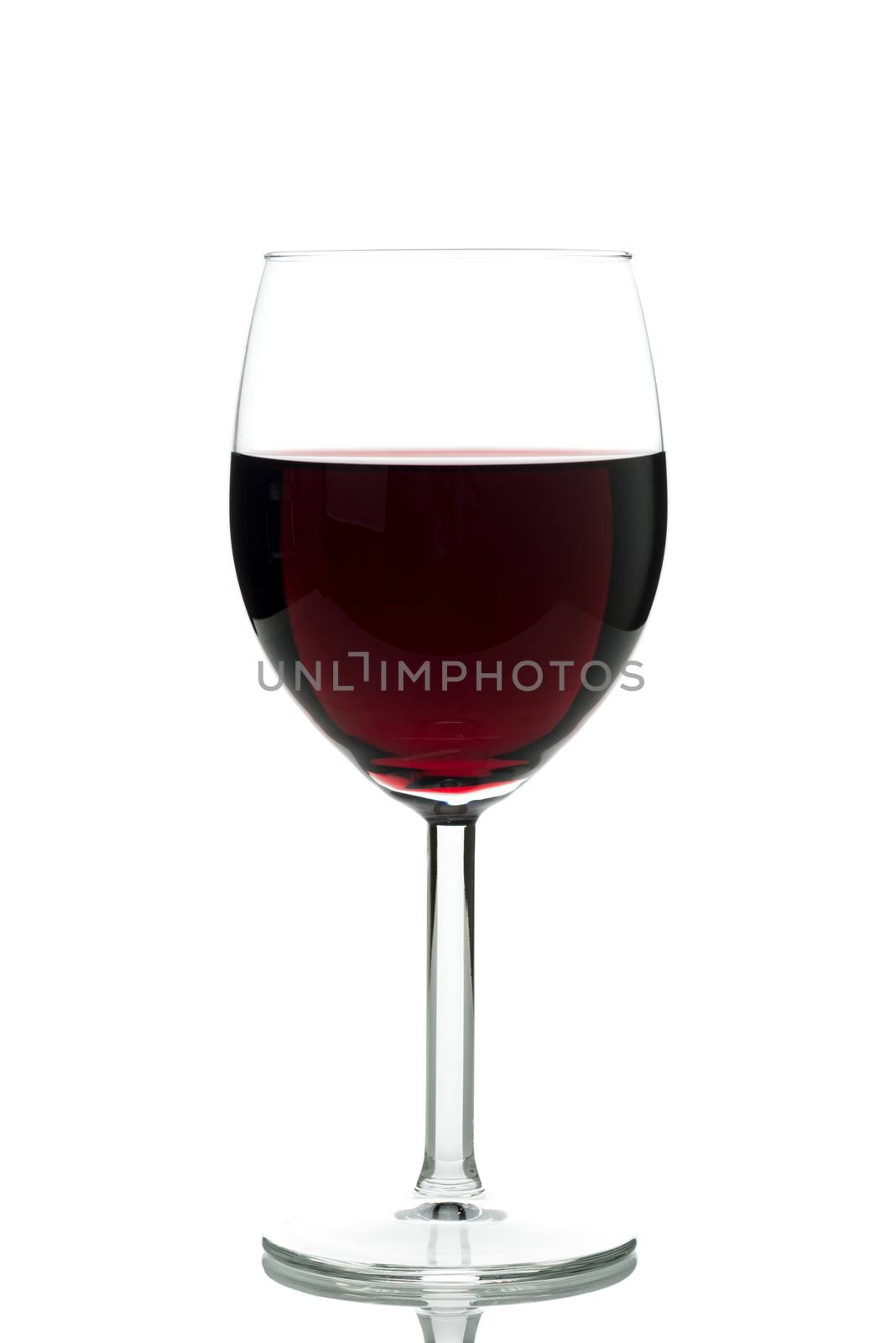 Red wine in a glass isolated on white background