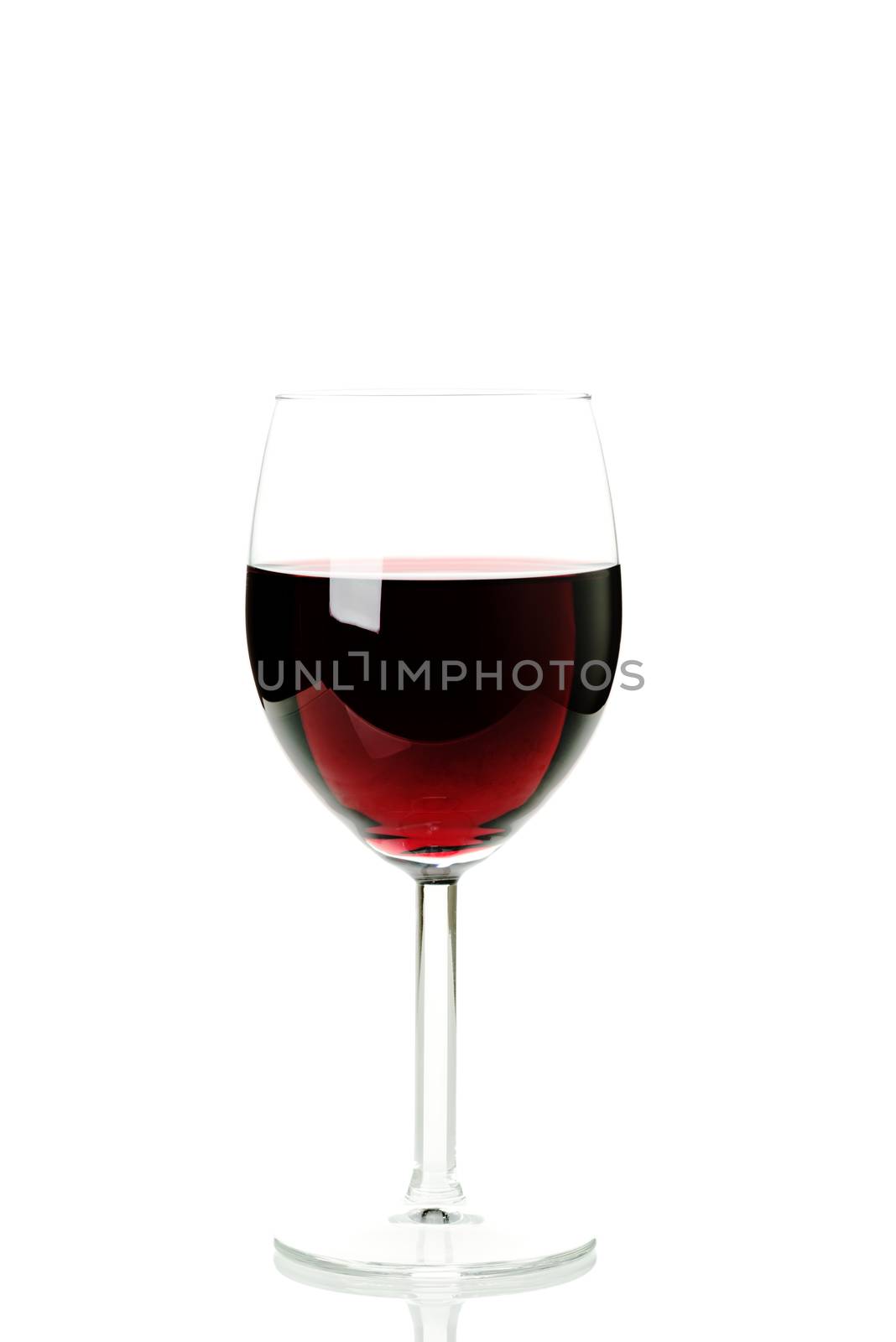 Red wine in a glass isolated by Nanisimova