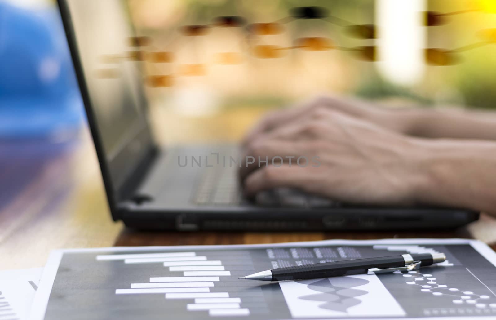 businessman hand working with new modern computer and business s by dfrsce