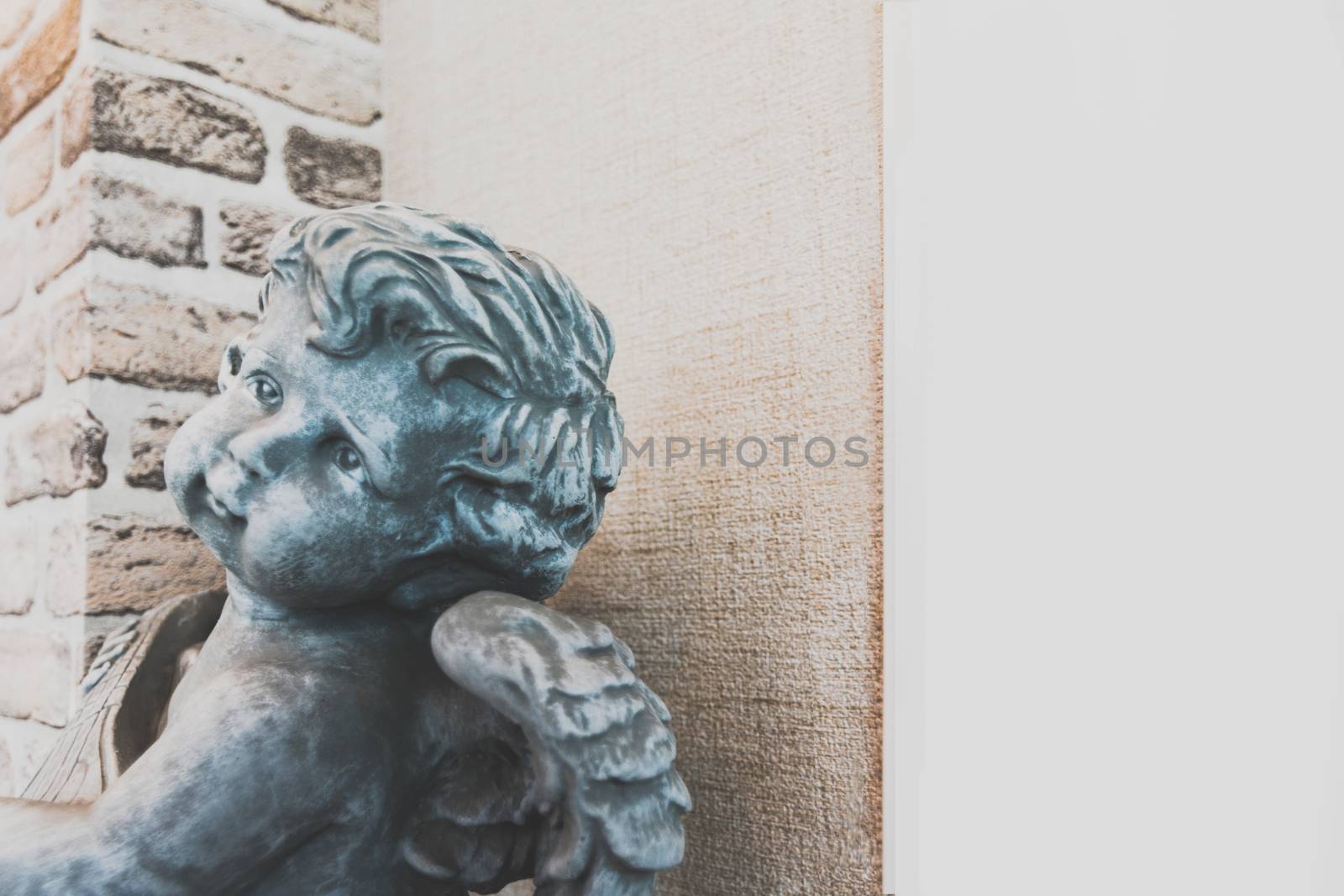 Angel cupid holding heart together. God of love.,selective focus.
