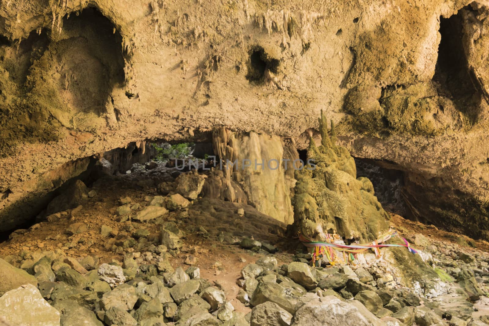 Sunlight through a cave hole in Thailand. by dfrsce