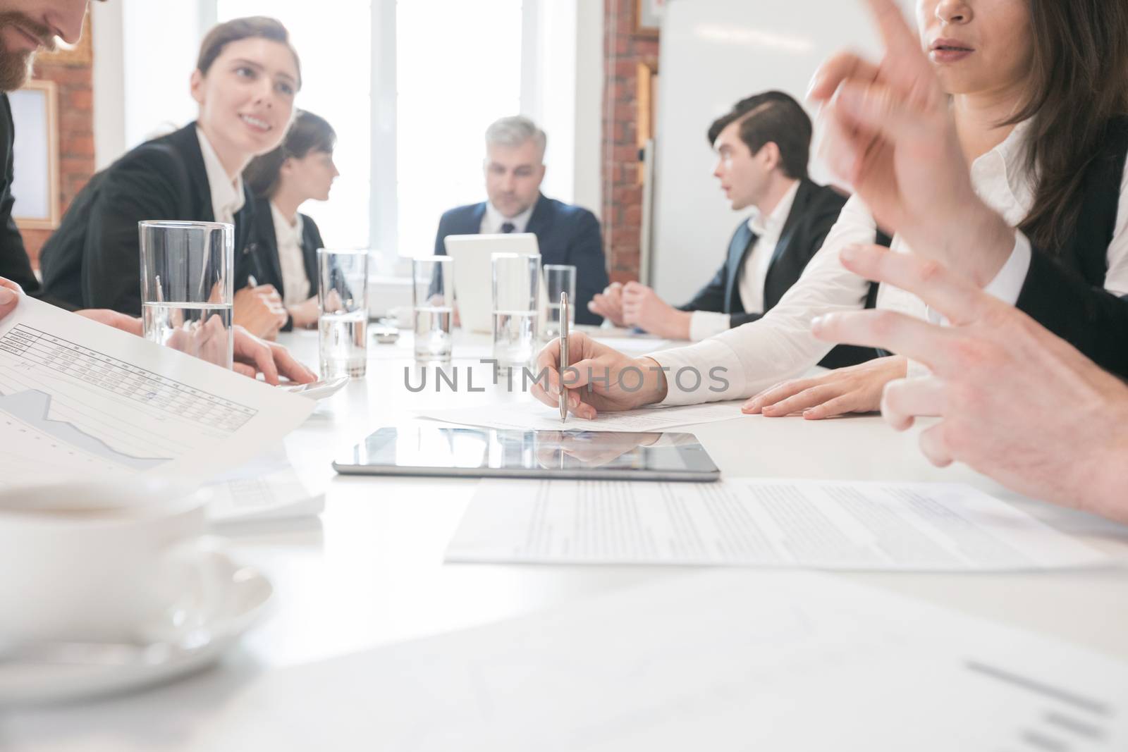 Group of business people in meeting room at office discuss financial reports