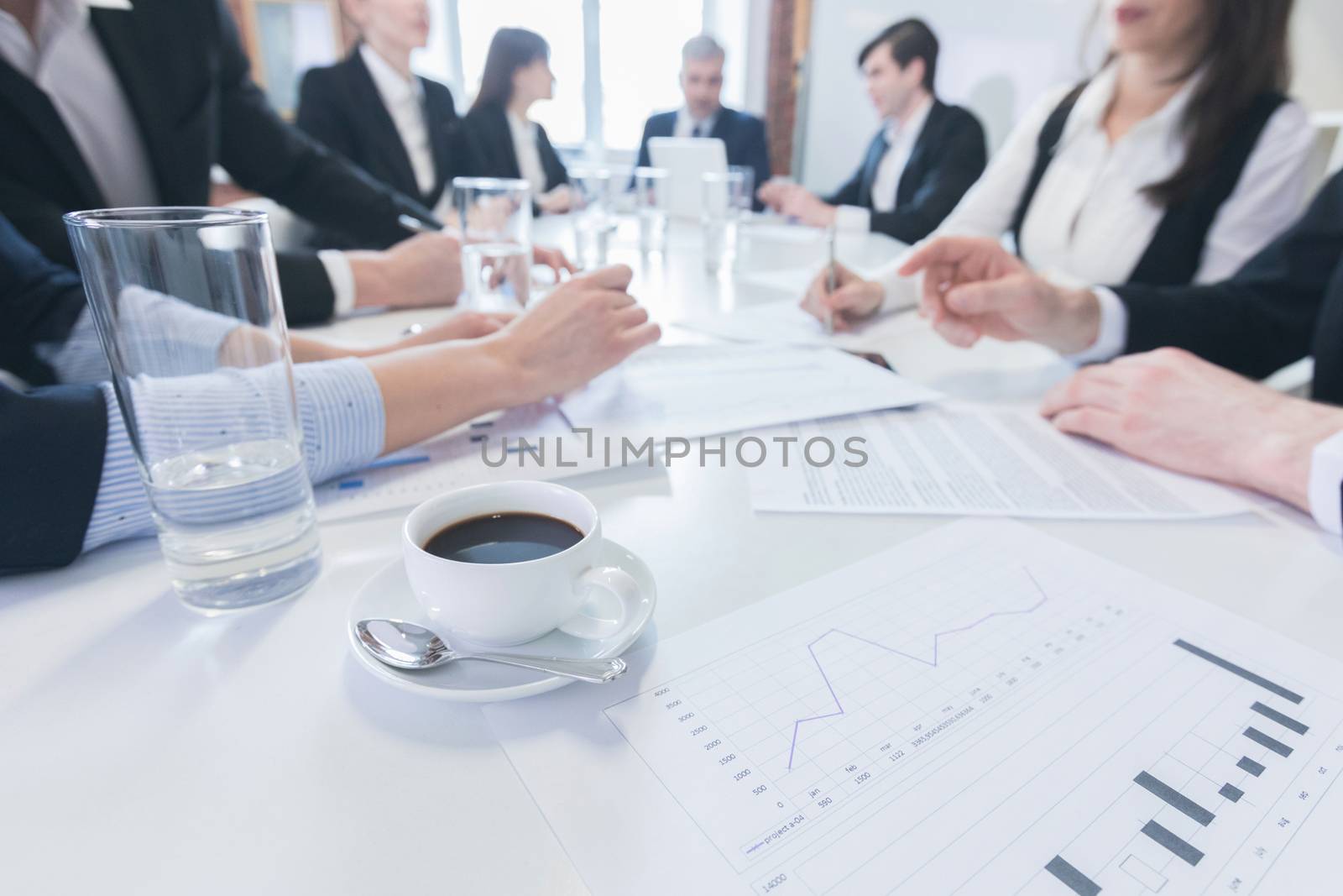 Group of business people in meeting room at office discuss financial reports