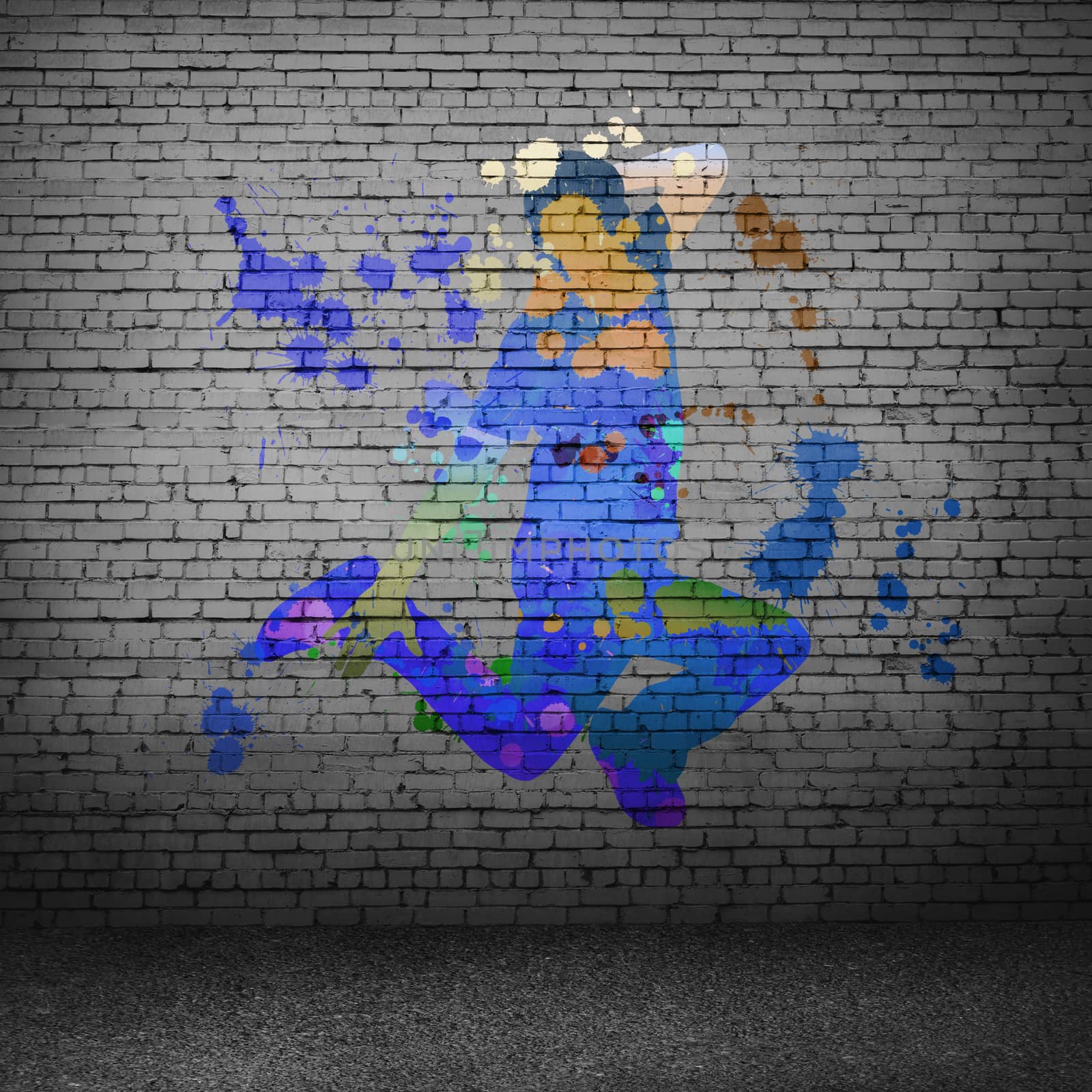 Image with color silhouette of dancer on gray wall