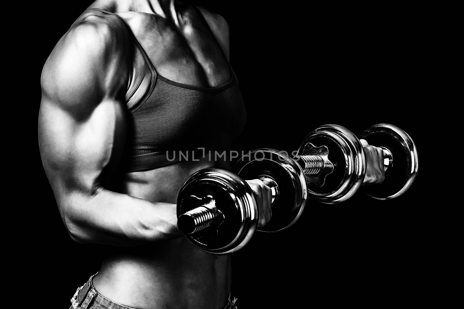 Fit woman with barbells, isolated on black