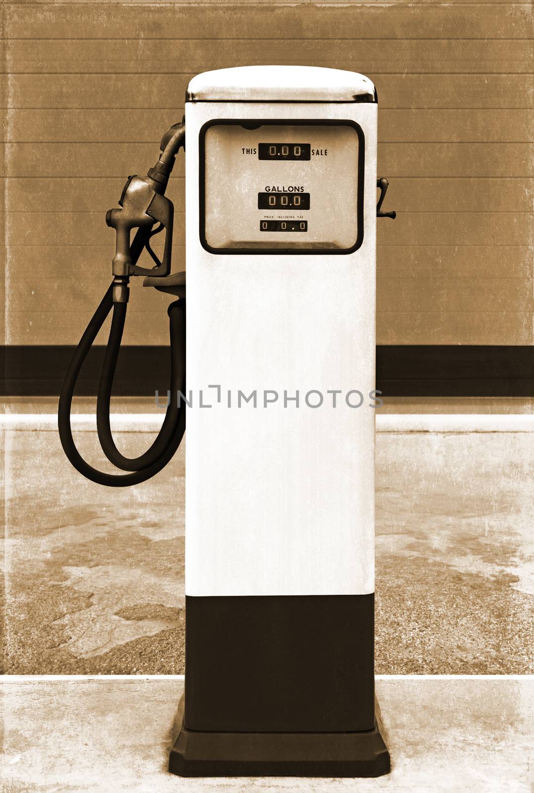vintage gasoline station gas pump in the setting of an old gas station