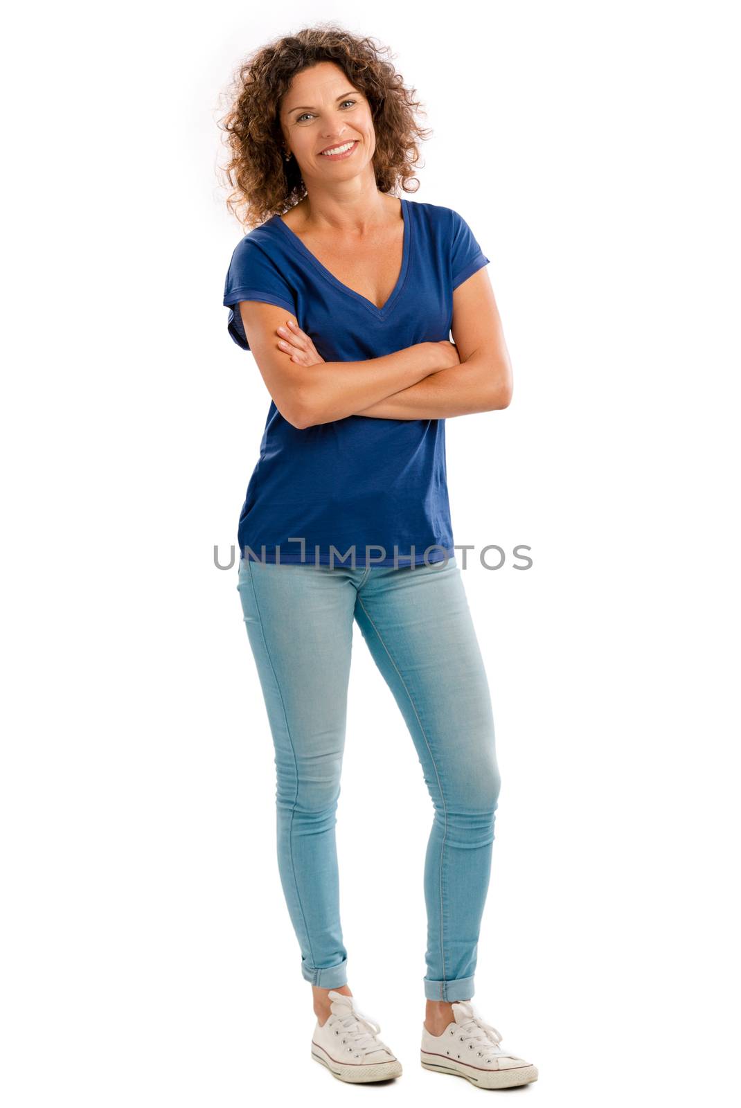 Smiling middle aged woman with arms folded, isolated on white background