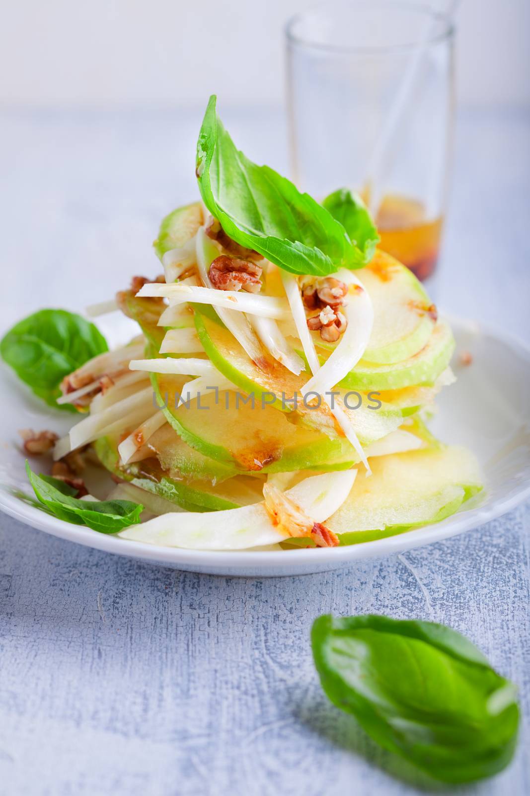 Fennel and apple salad on a wooden surface