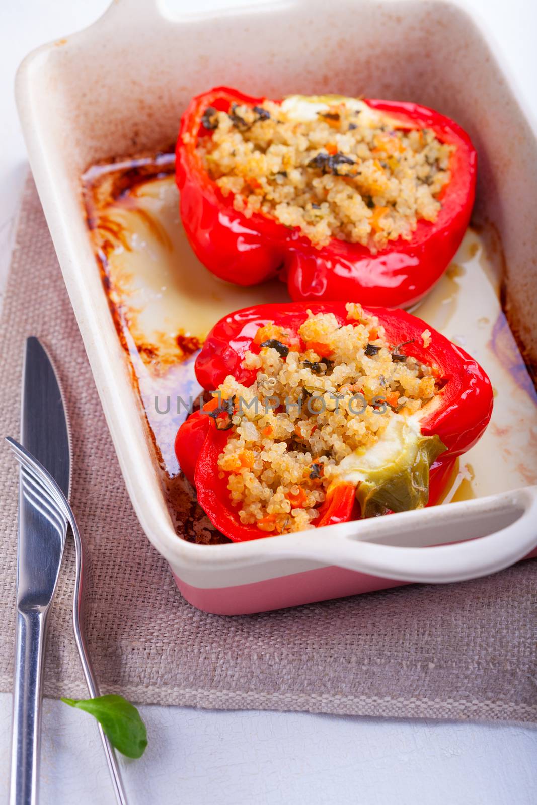 Stuffed red peppers filled with quinoa and vegetables