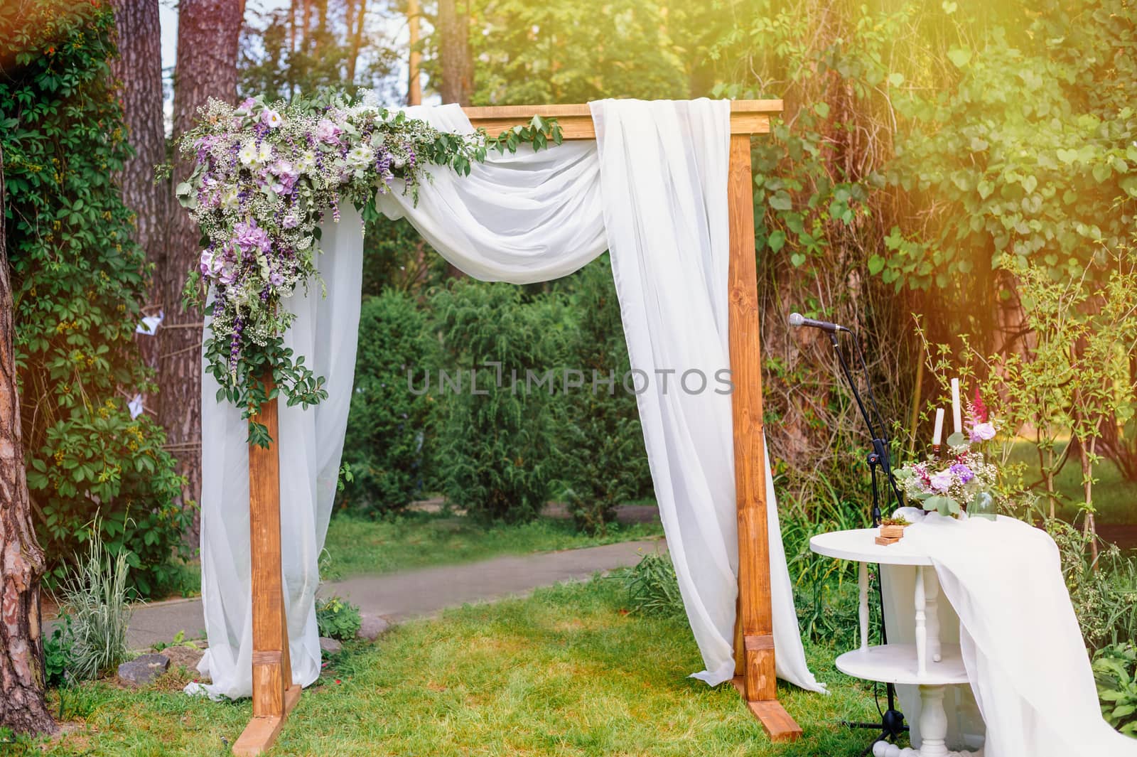 wedding arch in the style of rustic pine summer park.