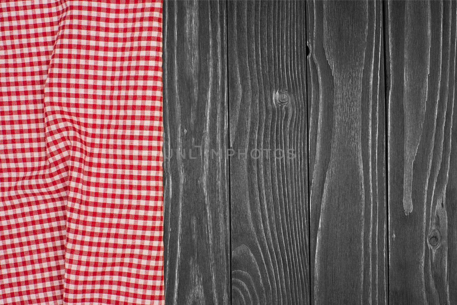 the checkered tablecloth on wooden table. Top view.