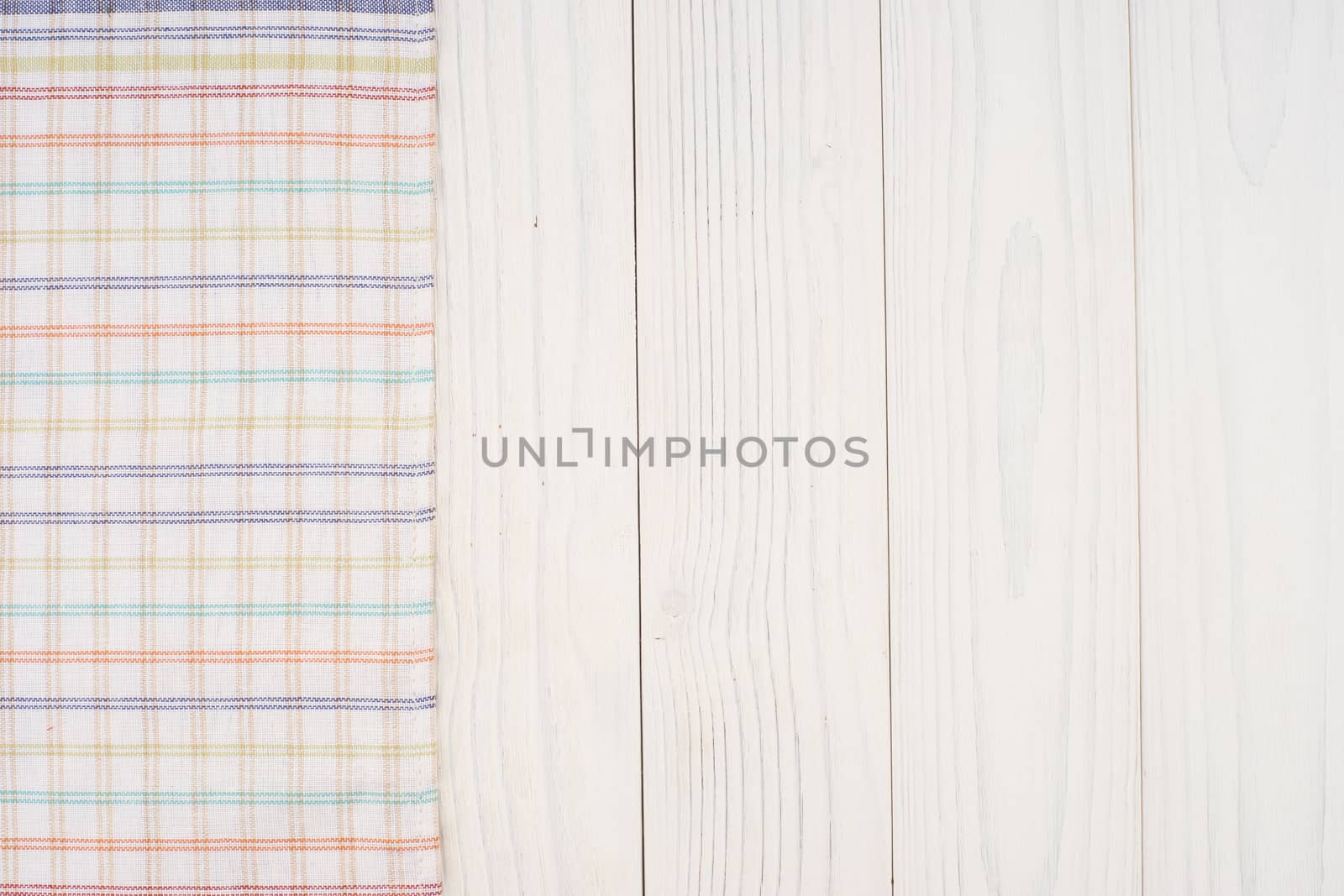Kitchen cloth on old white wooden table. by DGolbay