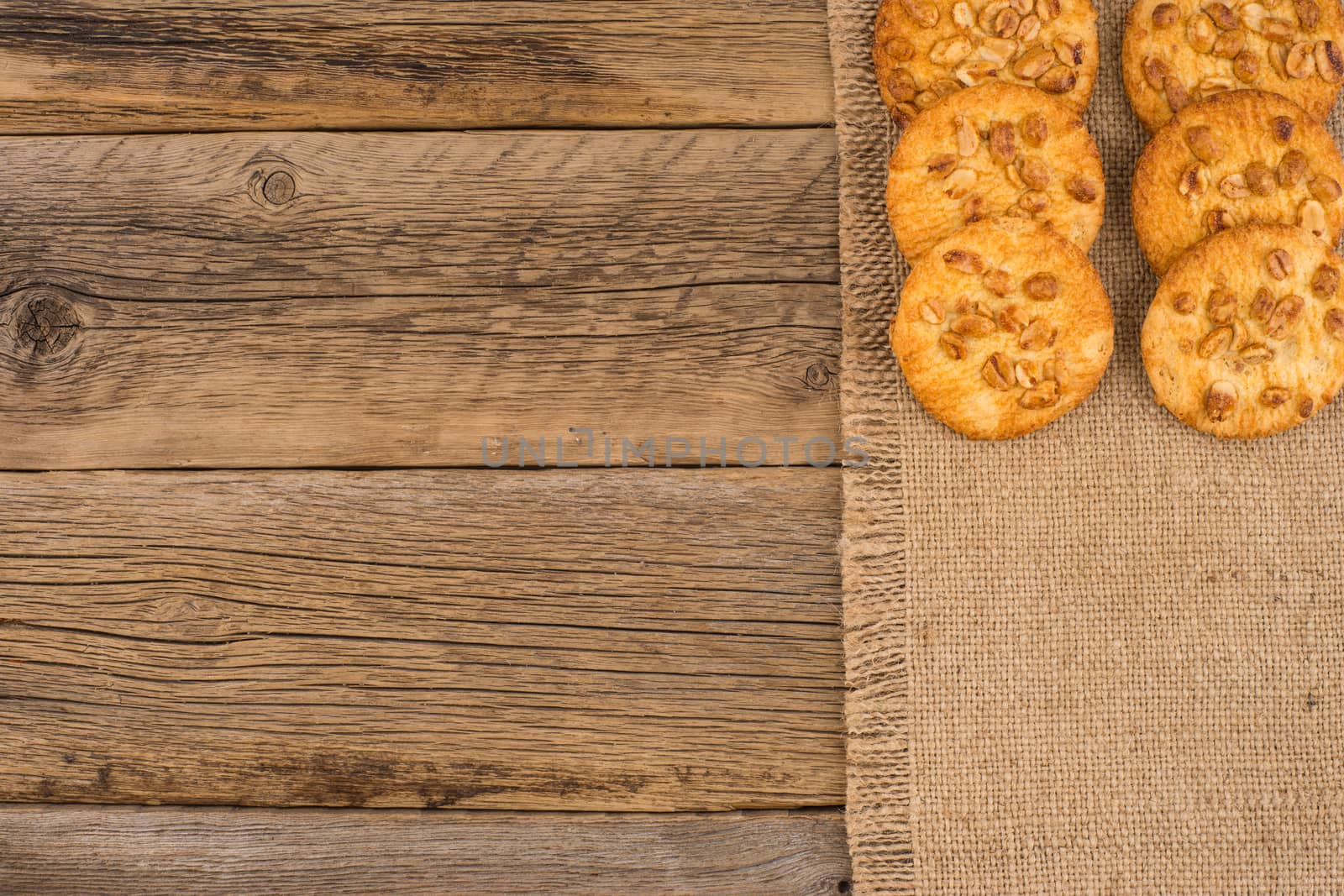 Cookies with peanut on old wooden table.  by DGolbay