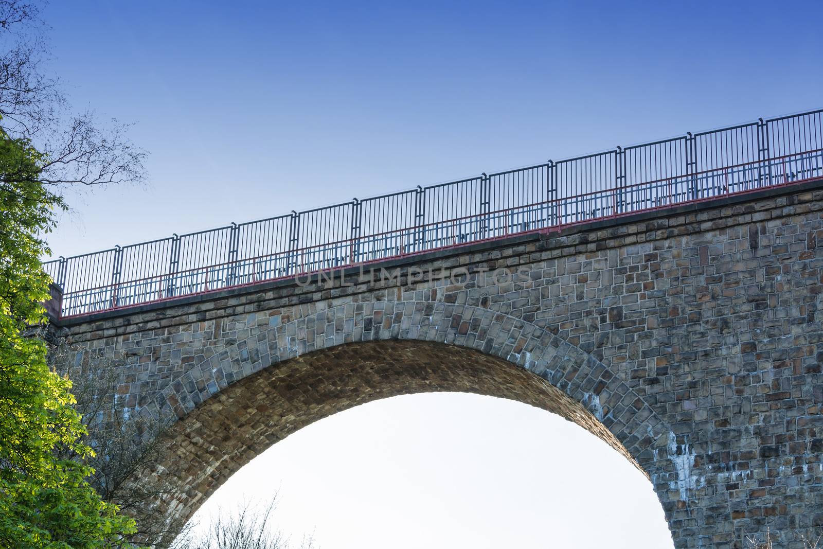 Old stone former railway bridge in Velbert, Germany. The name of the bridge is called Eulenbach bridge or Saubrücke.