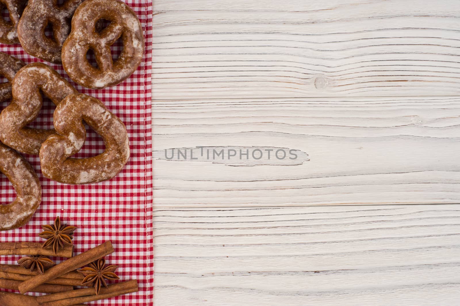 Gingerbread heart cookies on a wooden white background. Top view.