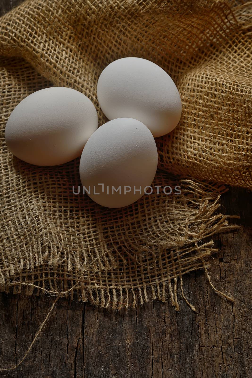 Fresh farm eggs on wooden background