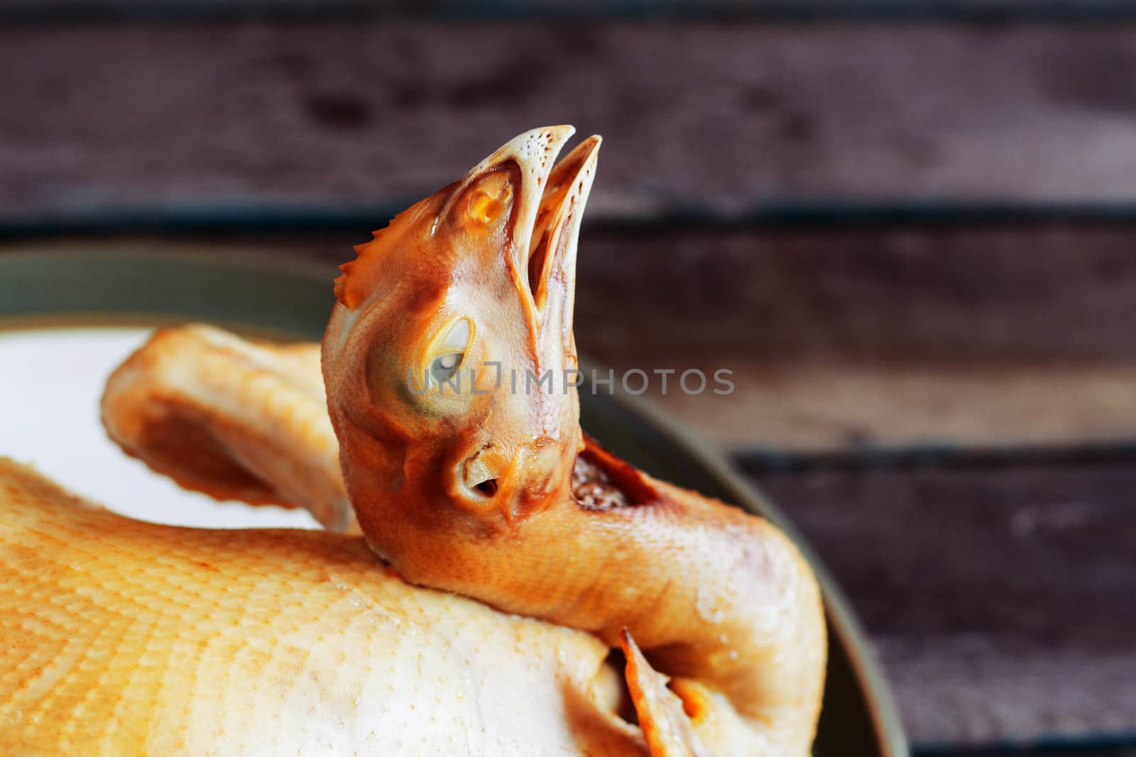 Chicken on a tray for cooking.