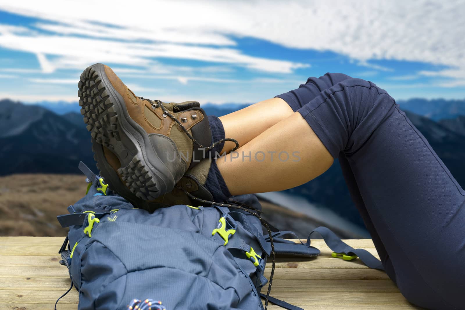 Hiking equipment, rucksack, boots and backpack. Concept for family hiking. Colorful background.