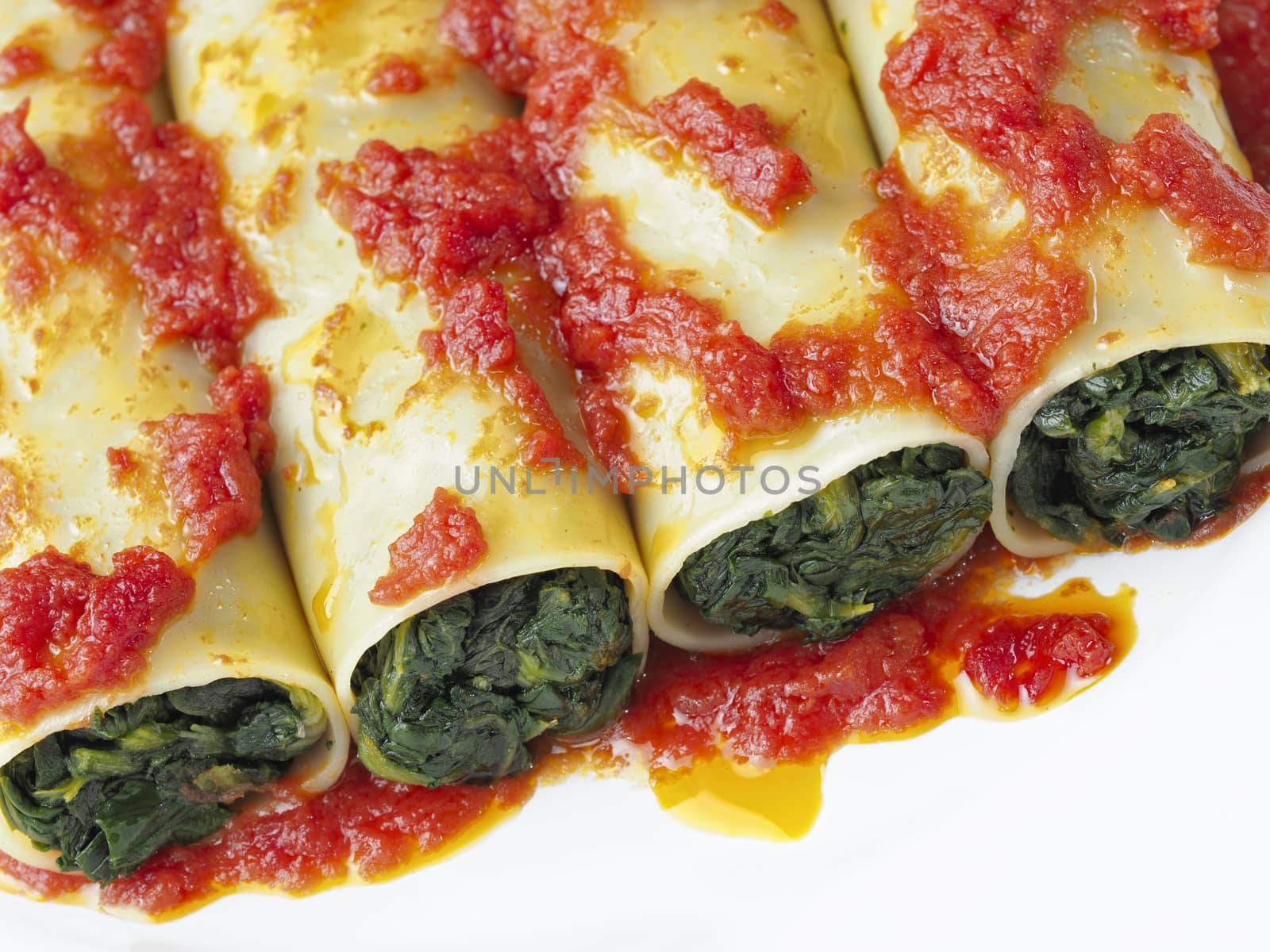 close up of rustic italian vegetarian spinach cannelloni pasta