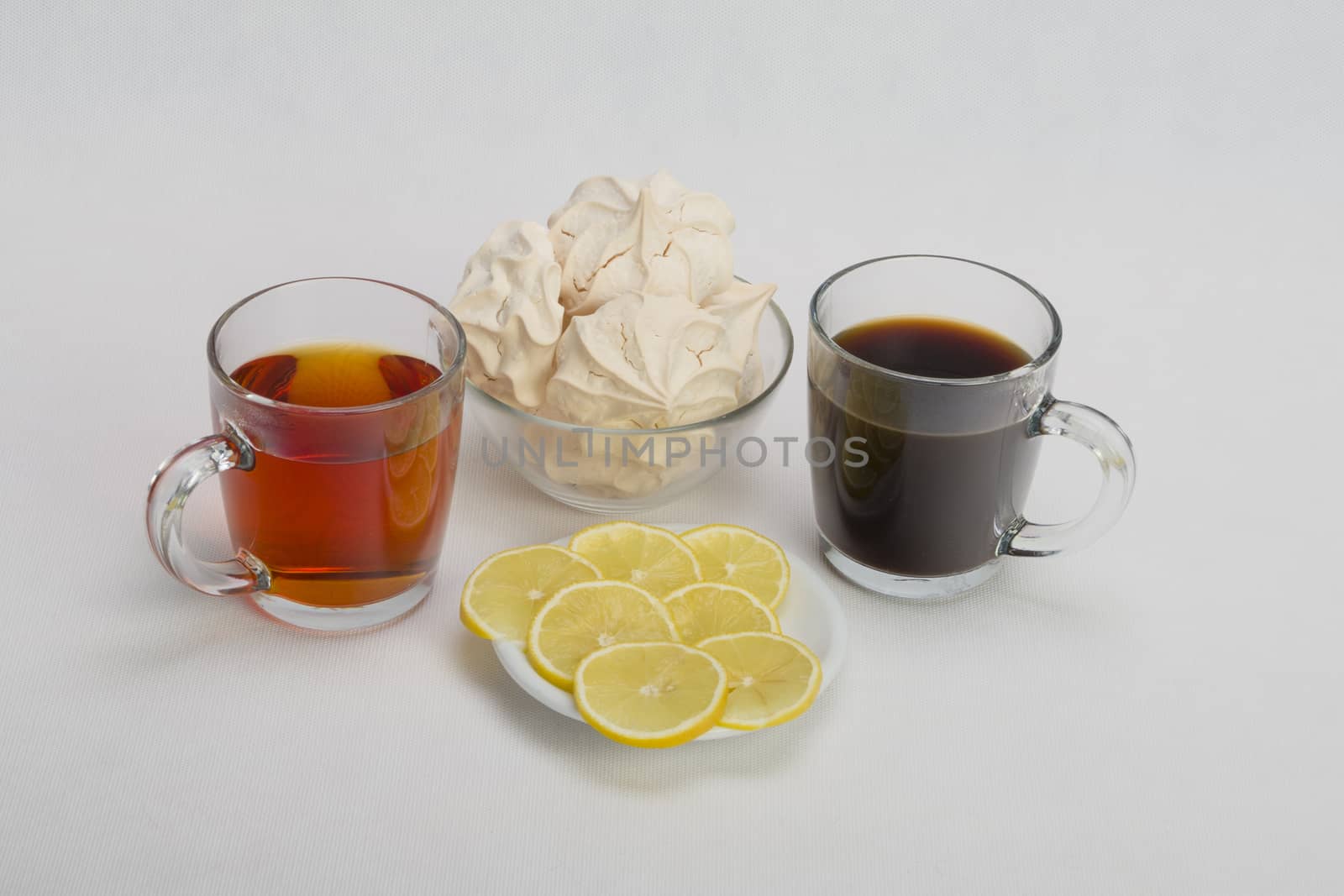 Fresh delicious meringue cookies served with tea or coffee macro