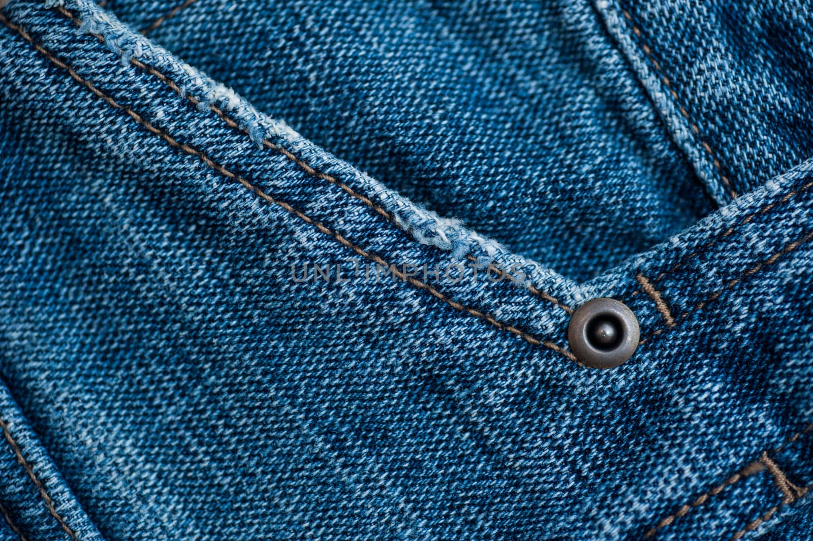 texture of jeans, stitching on the pants closeup by timonko