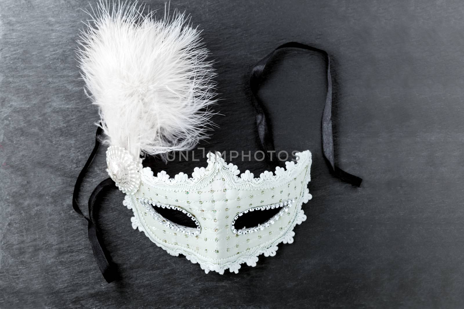 Carnival mask on a black background. Purim Symbols