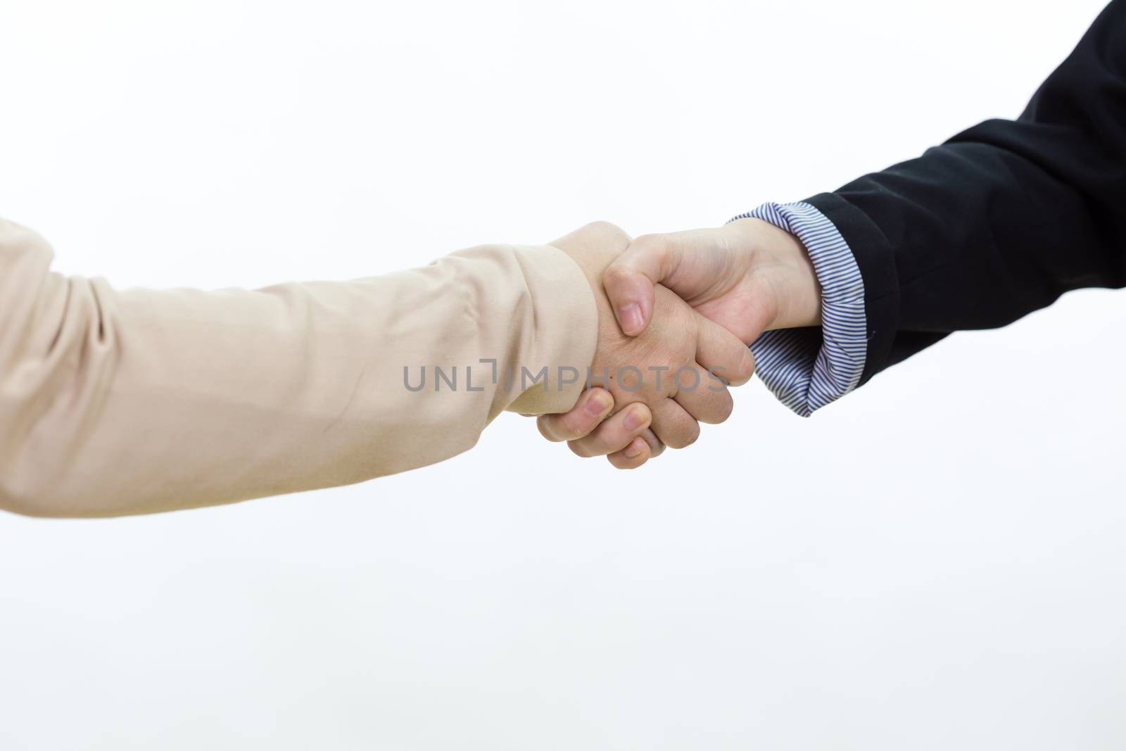 Businesswoman in casual office clothes shaking hands