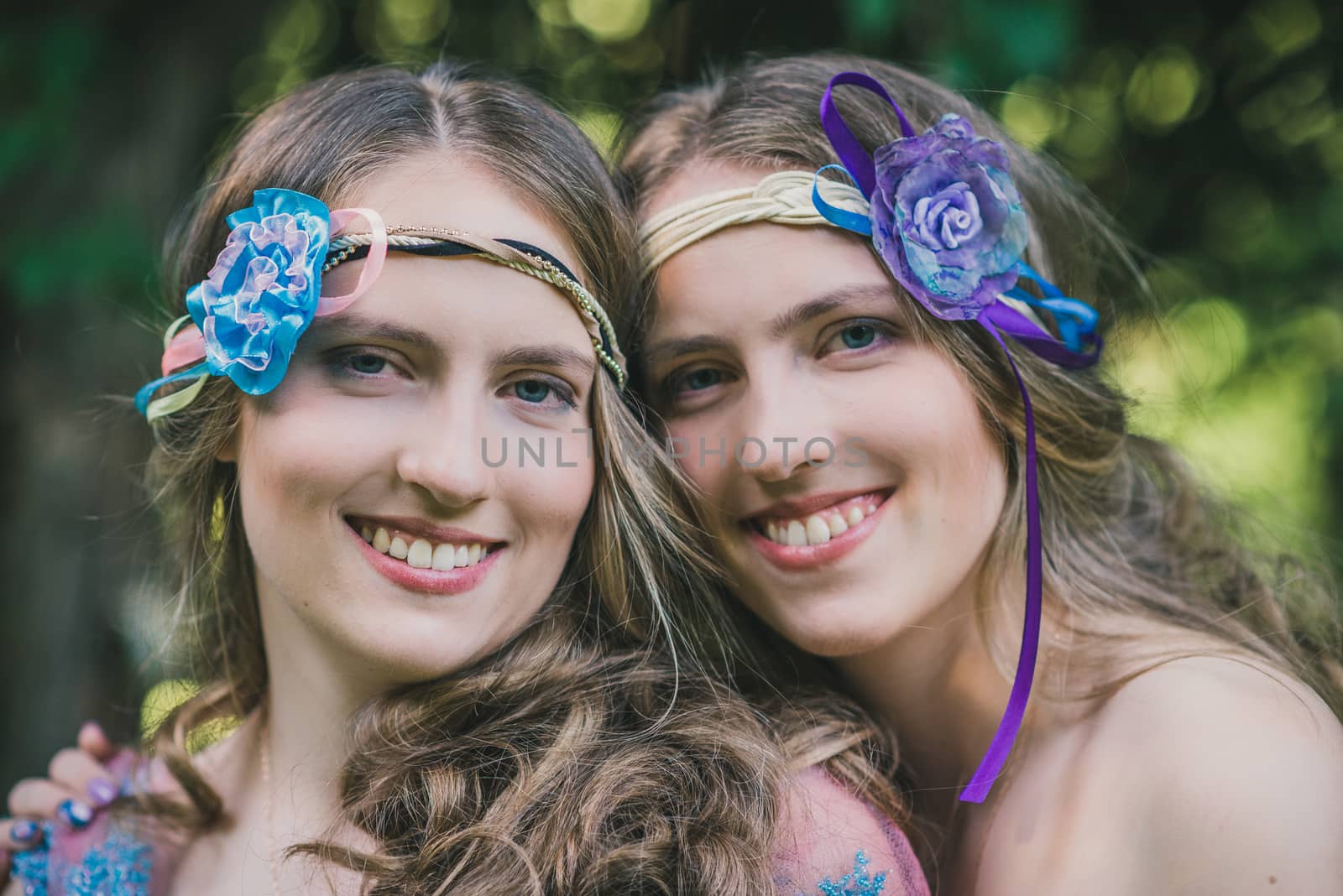 Portrait of two sisters of twins in summer