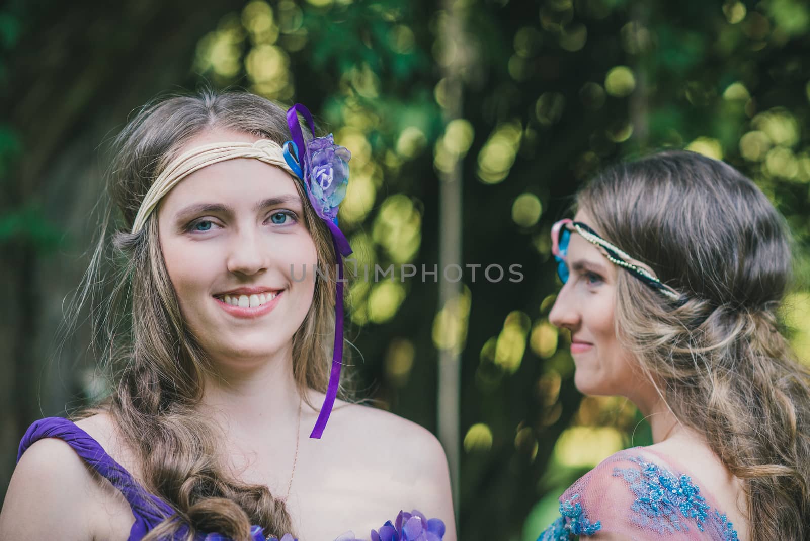 Portrait of two sisters twins in summer