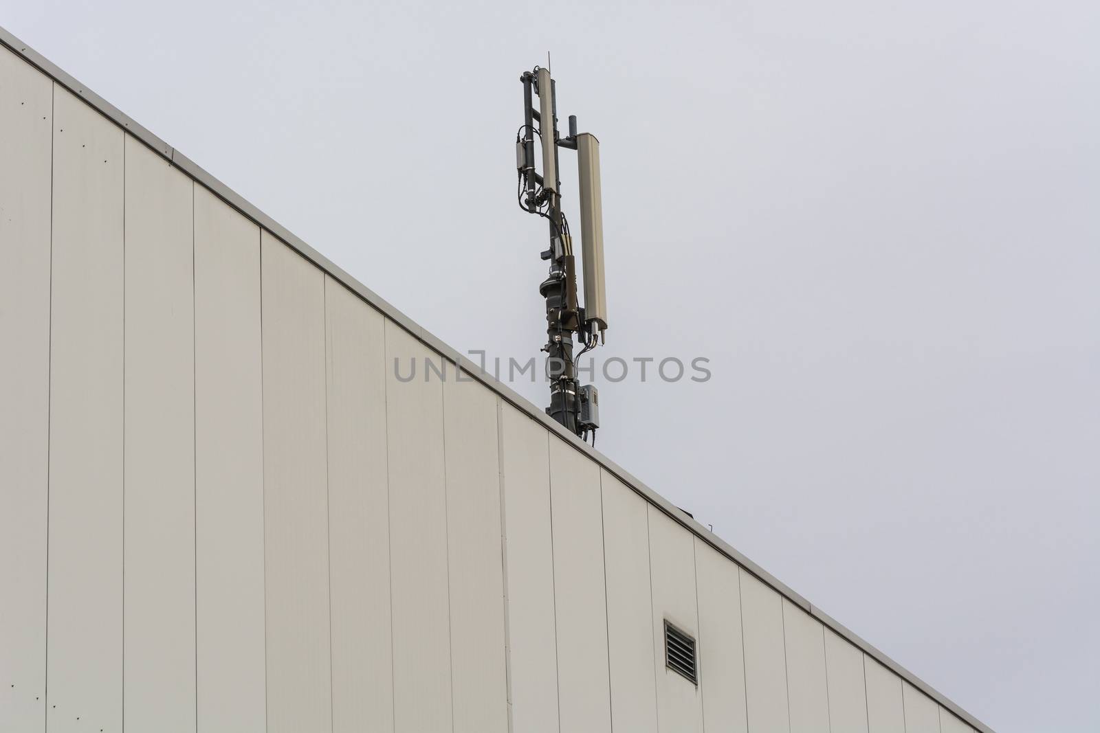 Antenna, telecommunications tower on a roof          by JFsPic