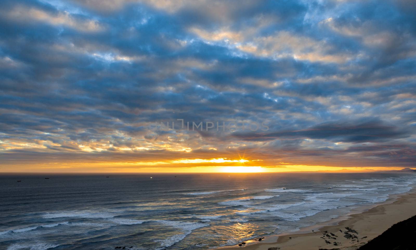 Beautiful sunset on the ocean at the coast of South Africa