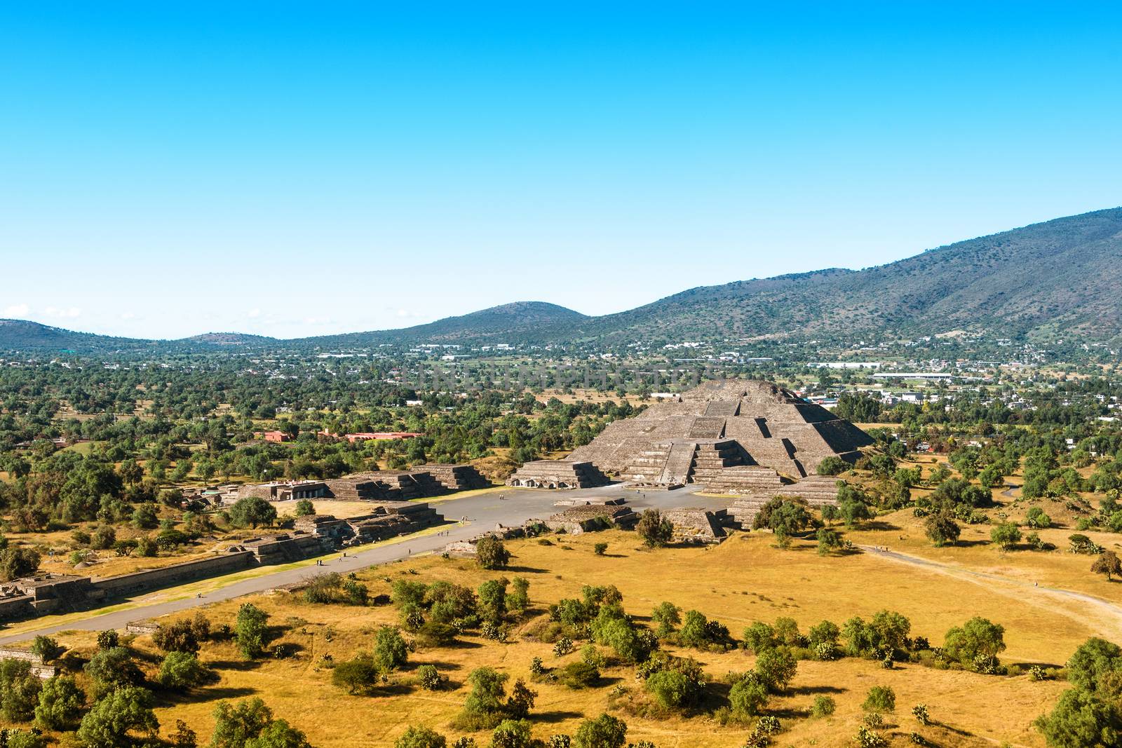 Pyramid of the Moon with Plaza of the Moon and a part of the Avenue of the Dead seen from the Pyramid of the Sun in San Joan Teotihuacan, near Mexico City, Mexico, on a sunny afternood.