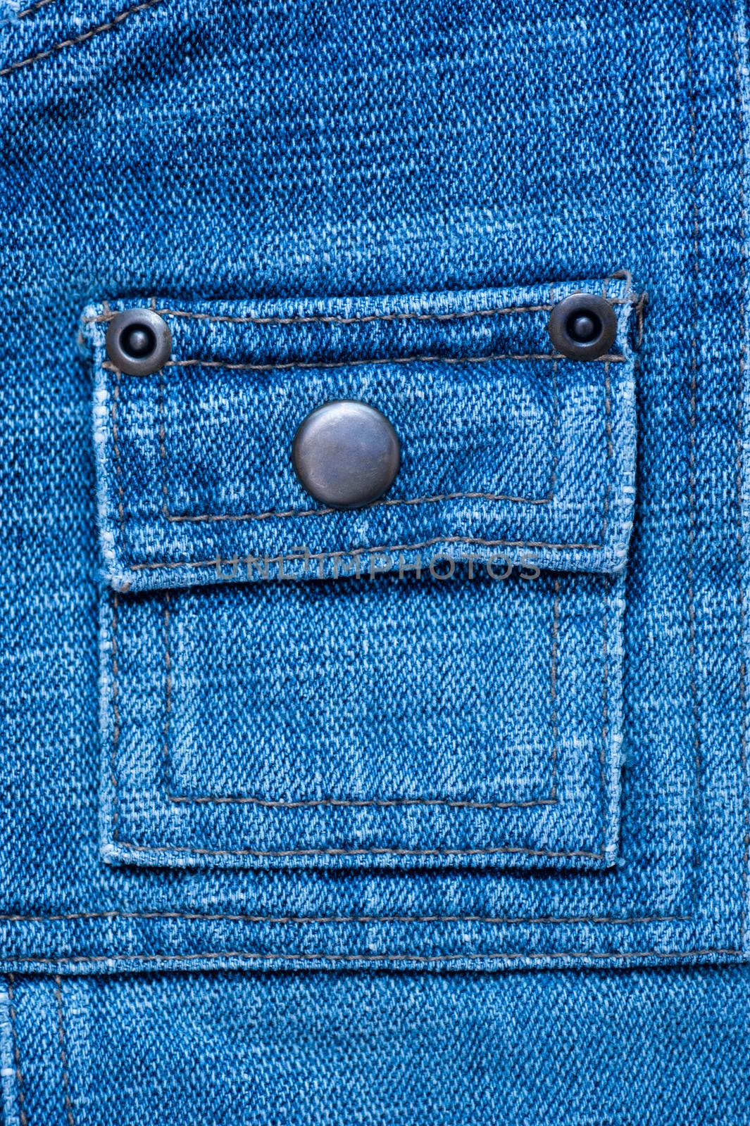 texture of denim with a pocket sewn in the middle thread