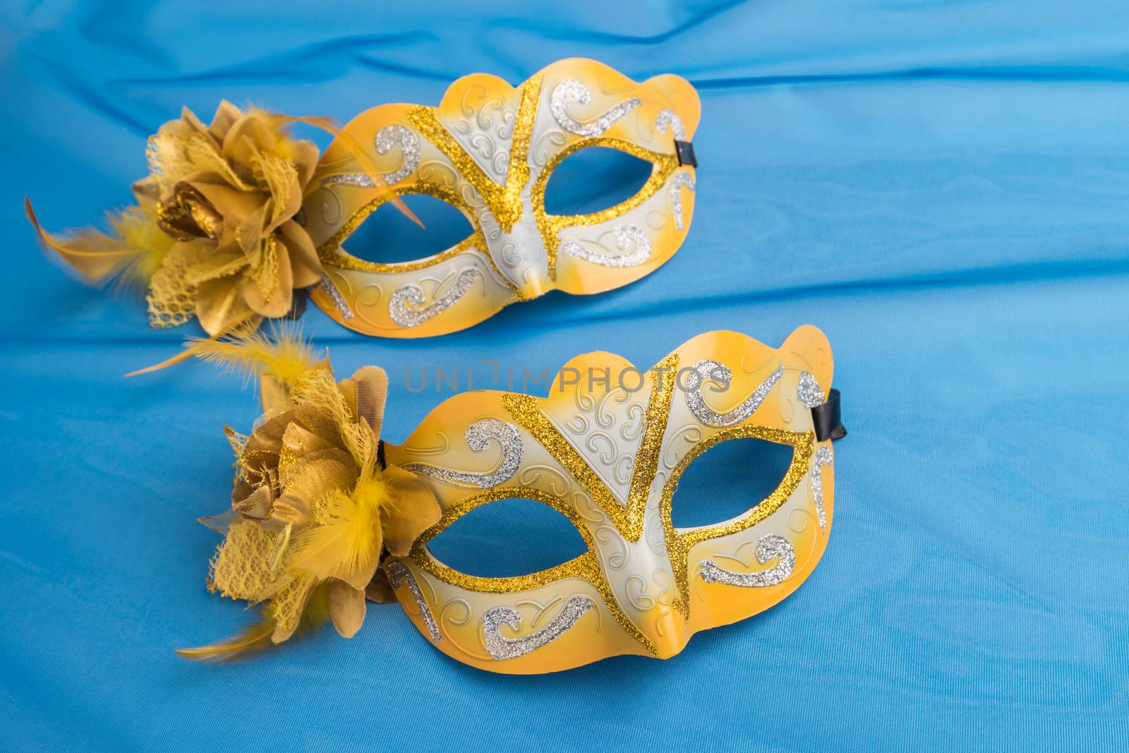 Carnival masks on blue background.
